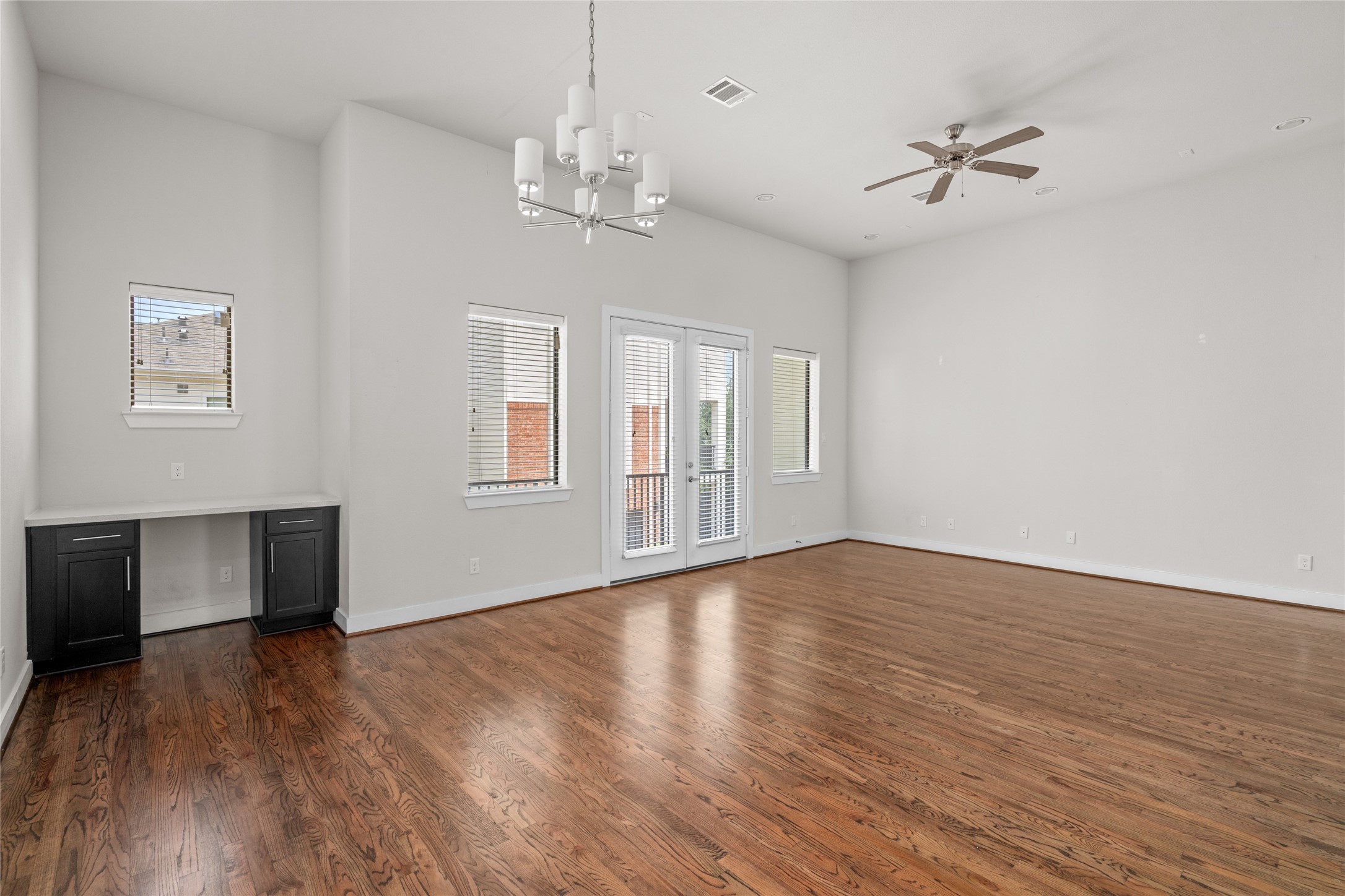 3409 Kensington Yellow Place Houston, TX 77008 - Photo 9 of 28 a view of an empty room with wooden floor and a window