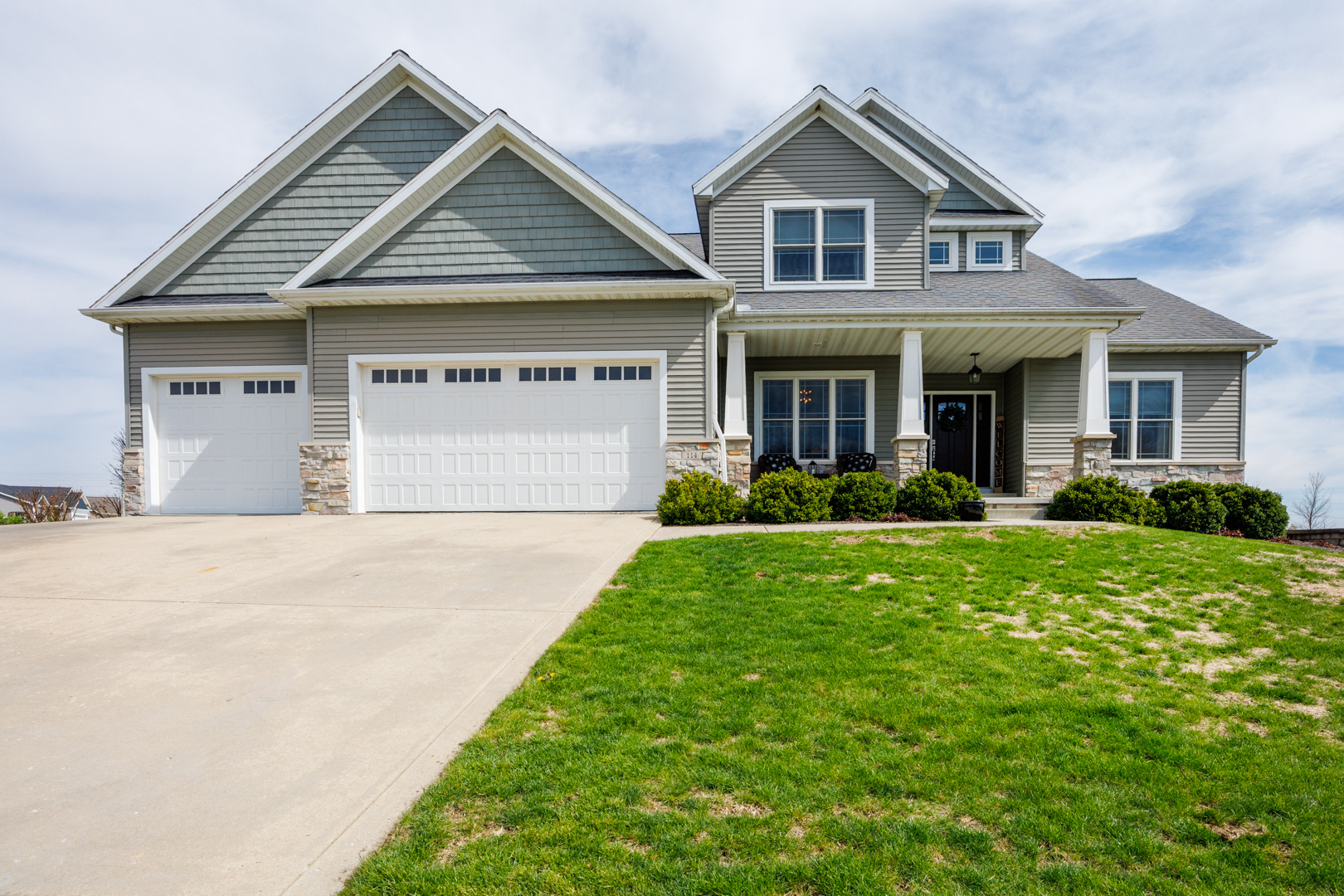 114 Mallard Way Hudson, IL 61748 - Photo 1 of 65 a front view of a house with garden