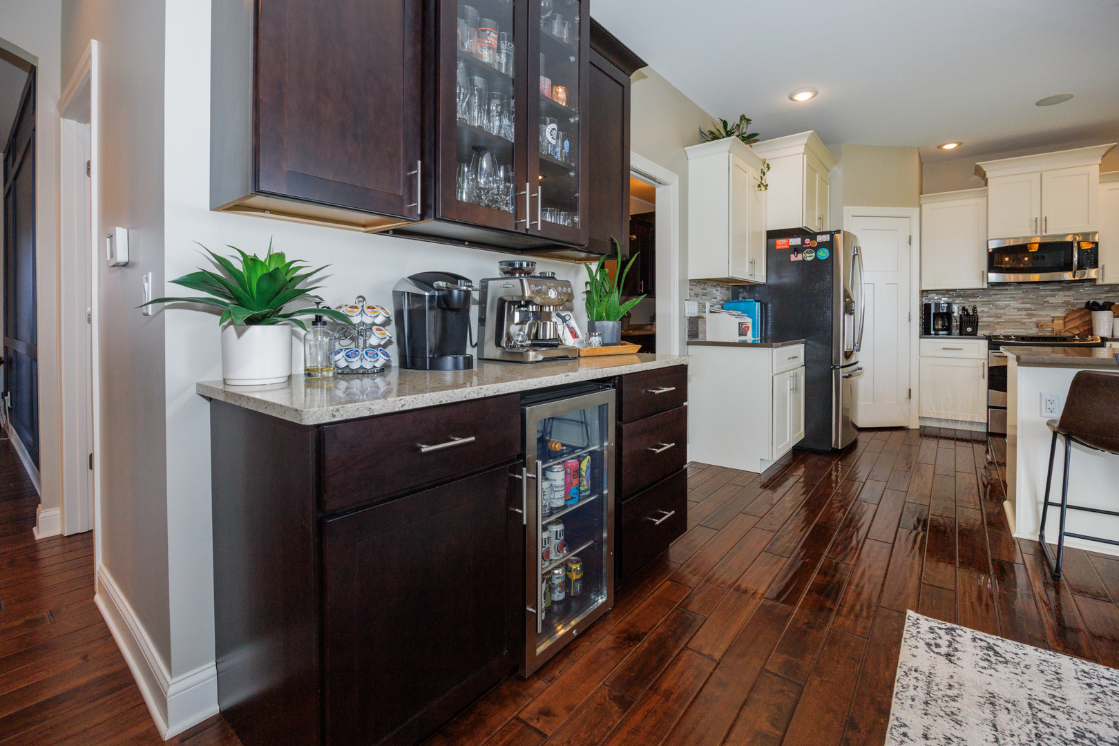 114 Mallard Way Hudson, IL 61748 - Photo 17 of 65 a kitchen with cabinets wooden floor and a refrigerator