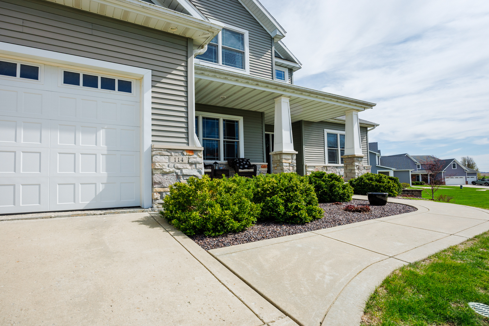 114 Mallard Way Hudson, IL 61748 - Photo 2 of 65 a front view of a house with garden
