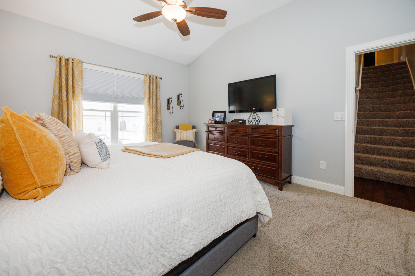 114 Mallard Way Hudson, IL 61748 - Photo 25 of 65 a bedroom with a bed and a flat screen tv