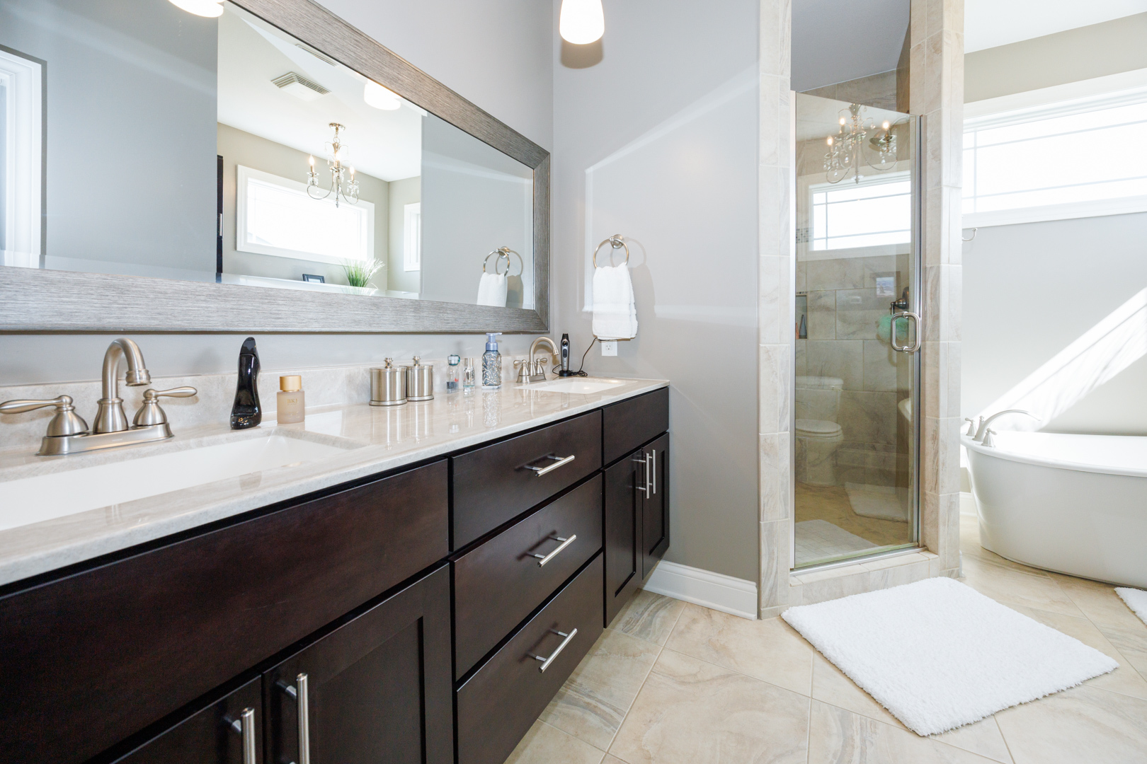114 Mallard Way Hudson, IL 61748 - Photo 27 of 65 a bathroom with a sink double vanity and a mirror