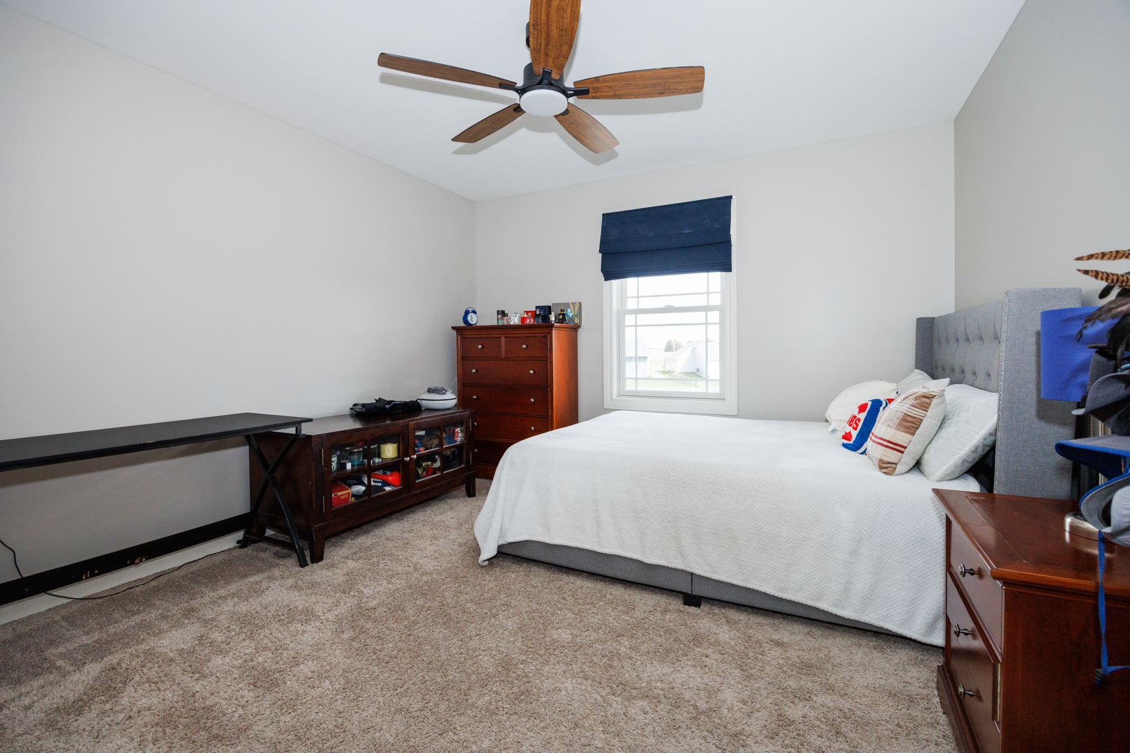 114 Mallard Way Hudson, IL 61748 - Photo 39 of 65 a bedroom with a bed and a chandelier