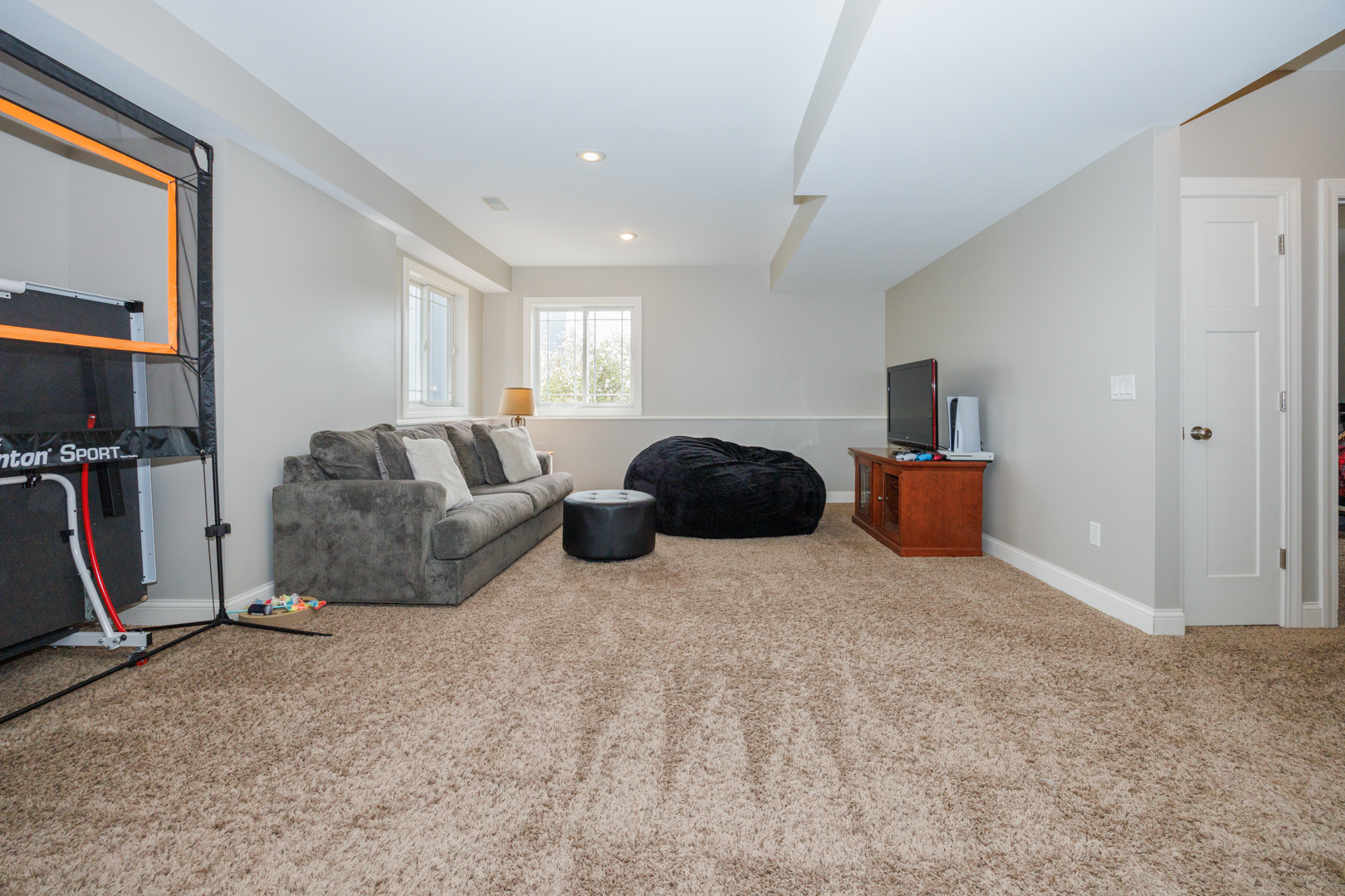114 Mallard Way Hudson, IL 61748 - Photo 45 of 65 a bed room with furniture and a flat screen tv