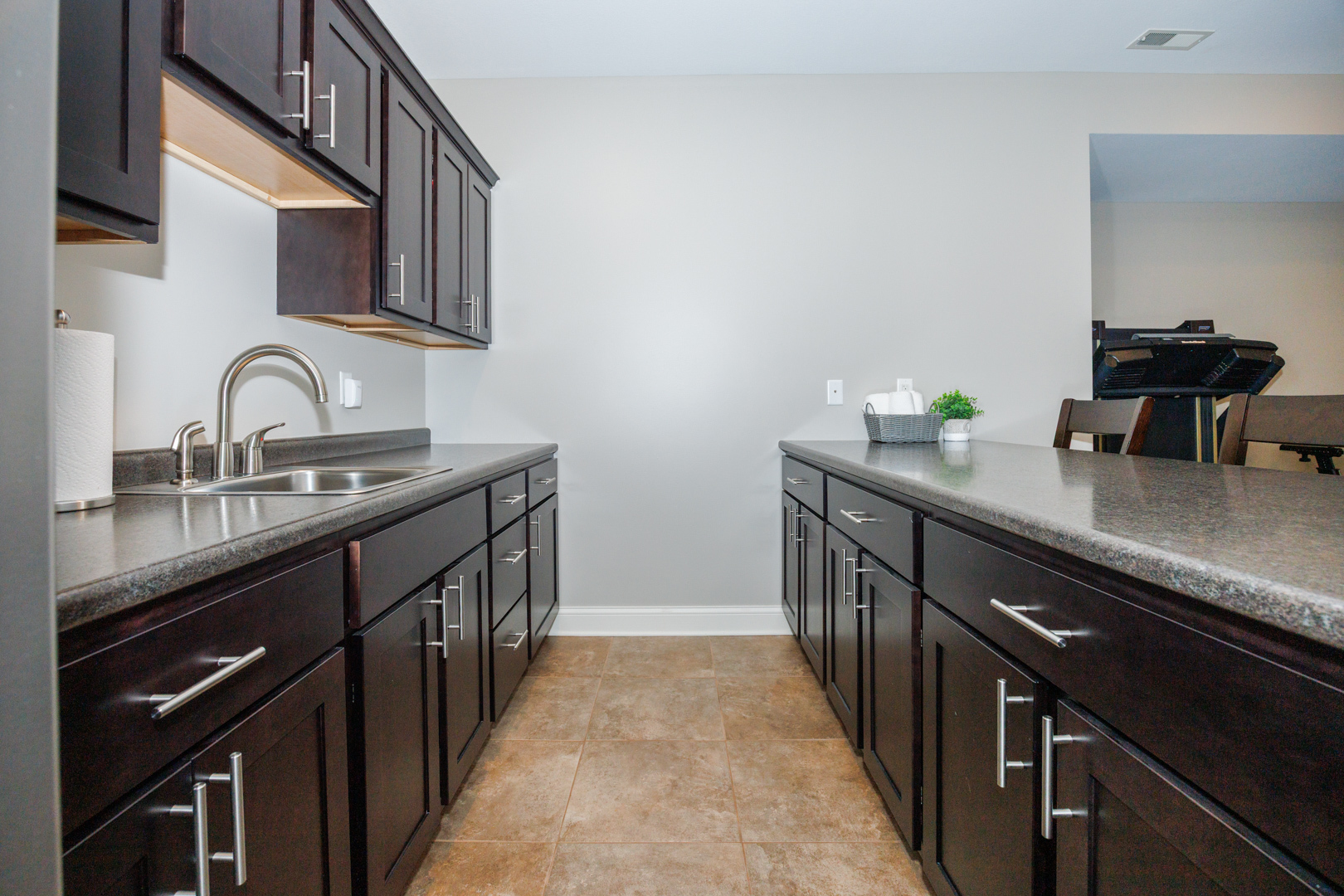 114 Mallard Way Hudson, IL 61748 - Photo 49 of 65 a kitchen with granite countertop a sink stove and cabinets