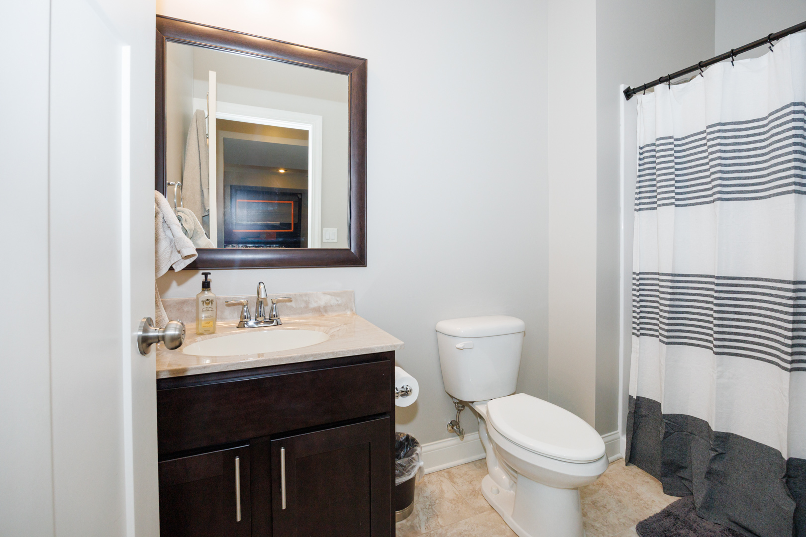 114 Mallard Way Hudson, IL 61748 - Photo 53 of 65 a bathroom with a toilet sink and mirror