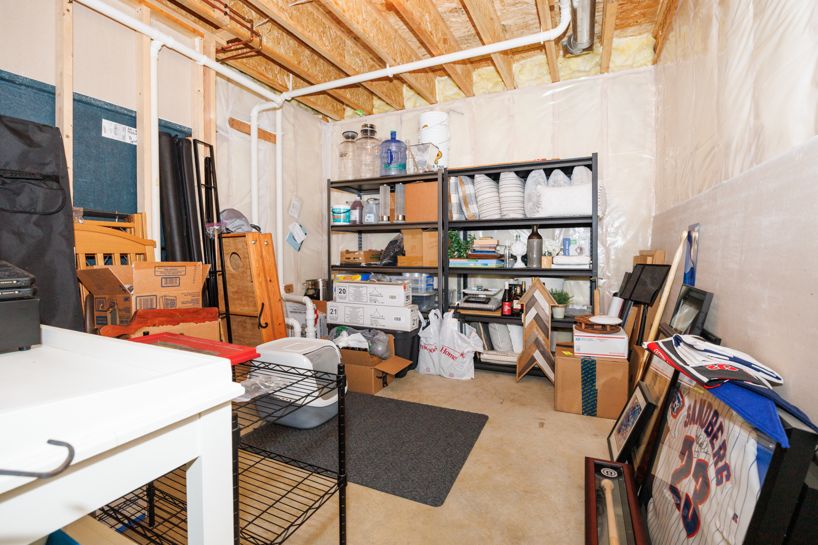 114 Mallard Way Hudson, IL 61748 - Photo 56 of 65 a view of a workspace with furniture and a rug
