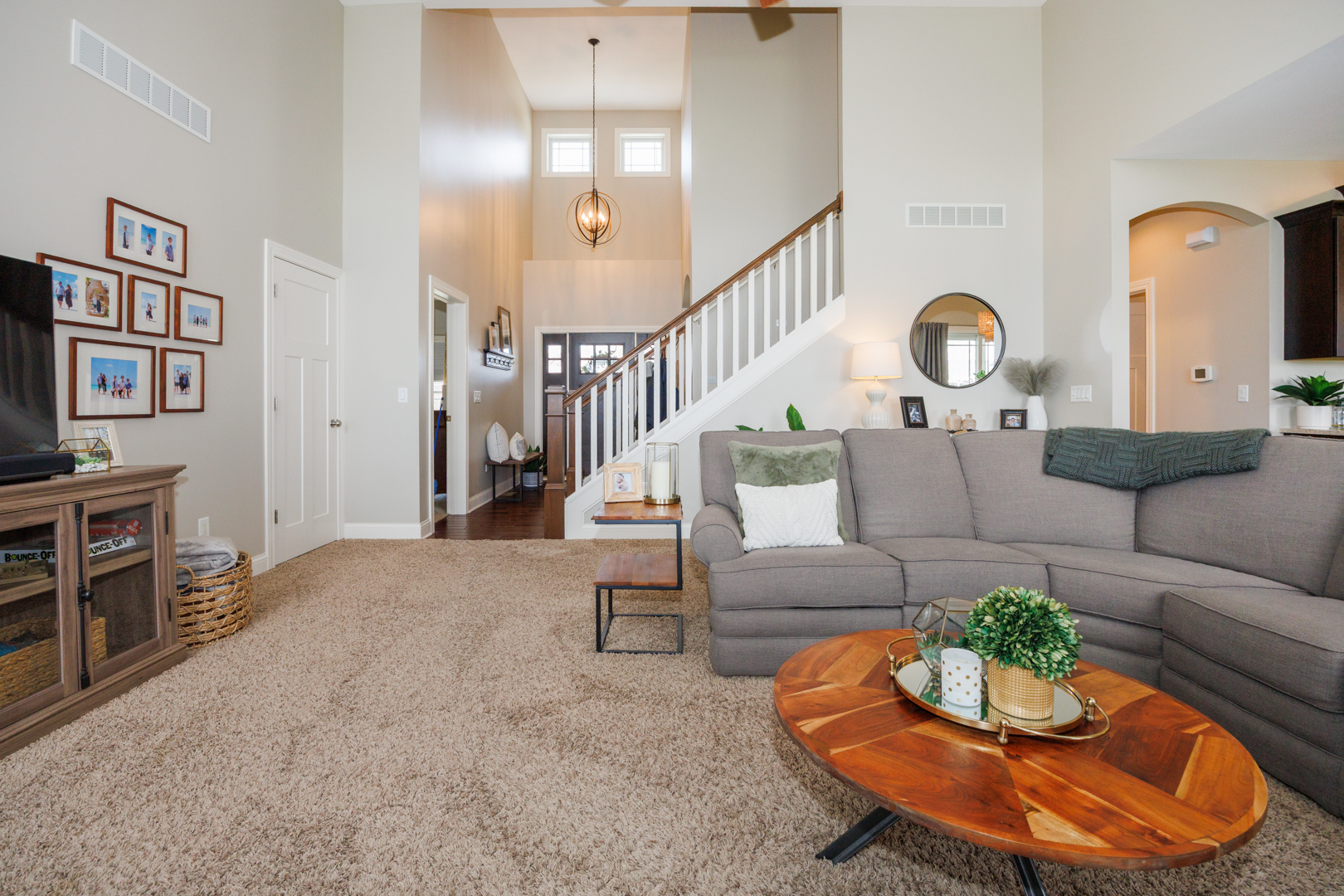 114 Mallard Way Hudson, IL 61748 - Photo 6 of 65 a living room with furniture a rug and a large window