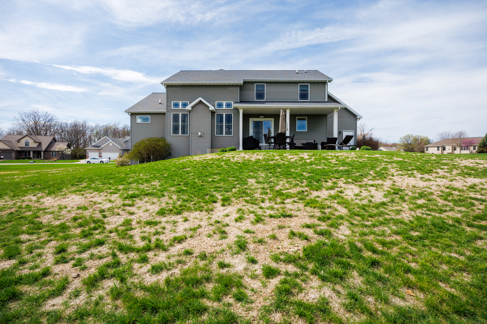 114 Mallard Way Hudson, IL 61748 - Photo 62 of 65 a front view of a house with a garden