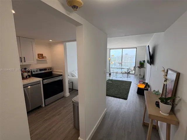 a kitchen with stainless steel appliances granite countertop a stove and a refrigerator