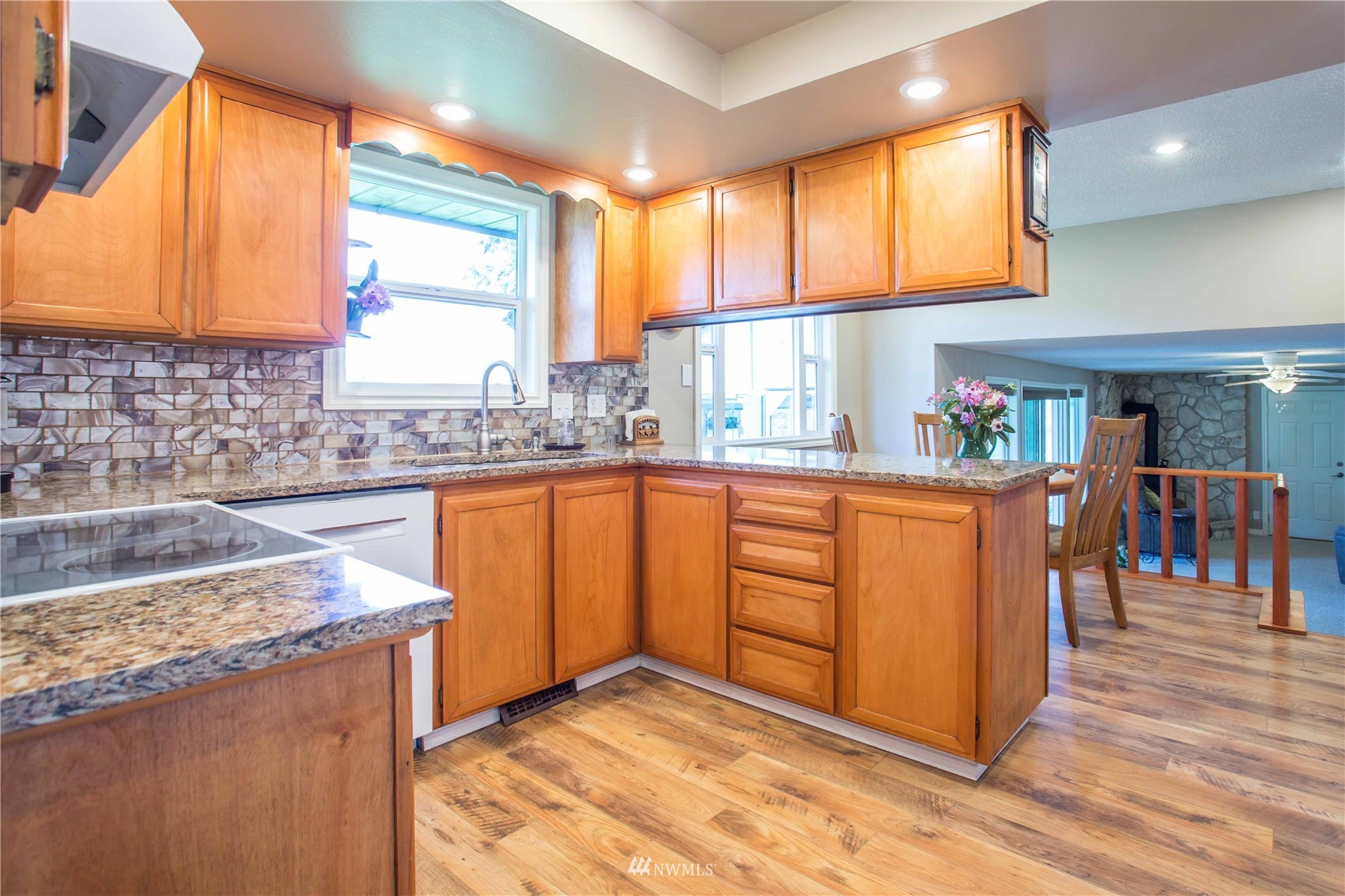 3951 Britton Road Bellingham, WA 98226 - Photo 14 of 39 a kitchen with stainless steel appliances granite countertop sink window and cabinets