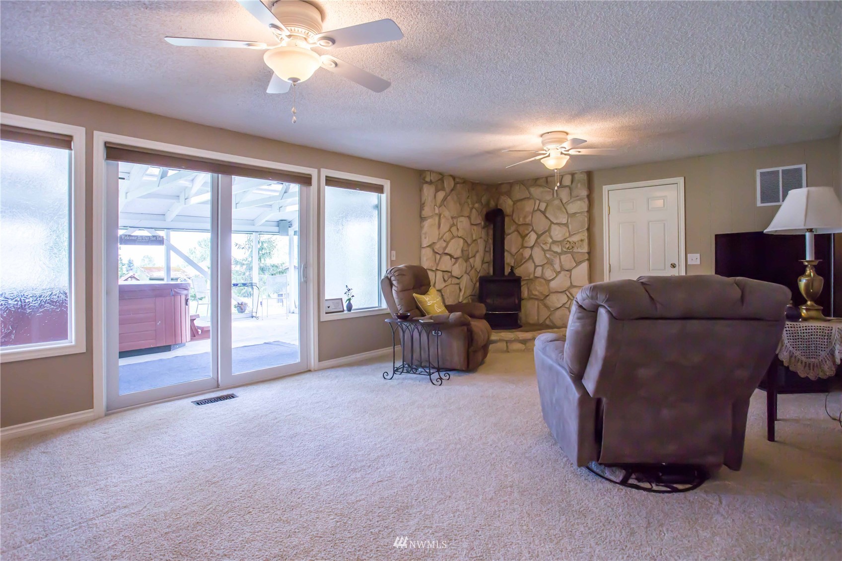 3951 Britton Road Bellingham, WA 98226 - Photo 18 of 39 a living room with furniture and a chandelier