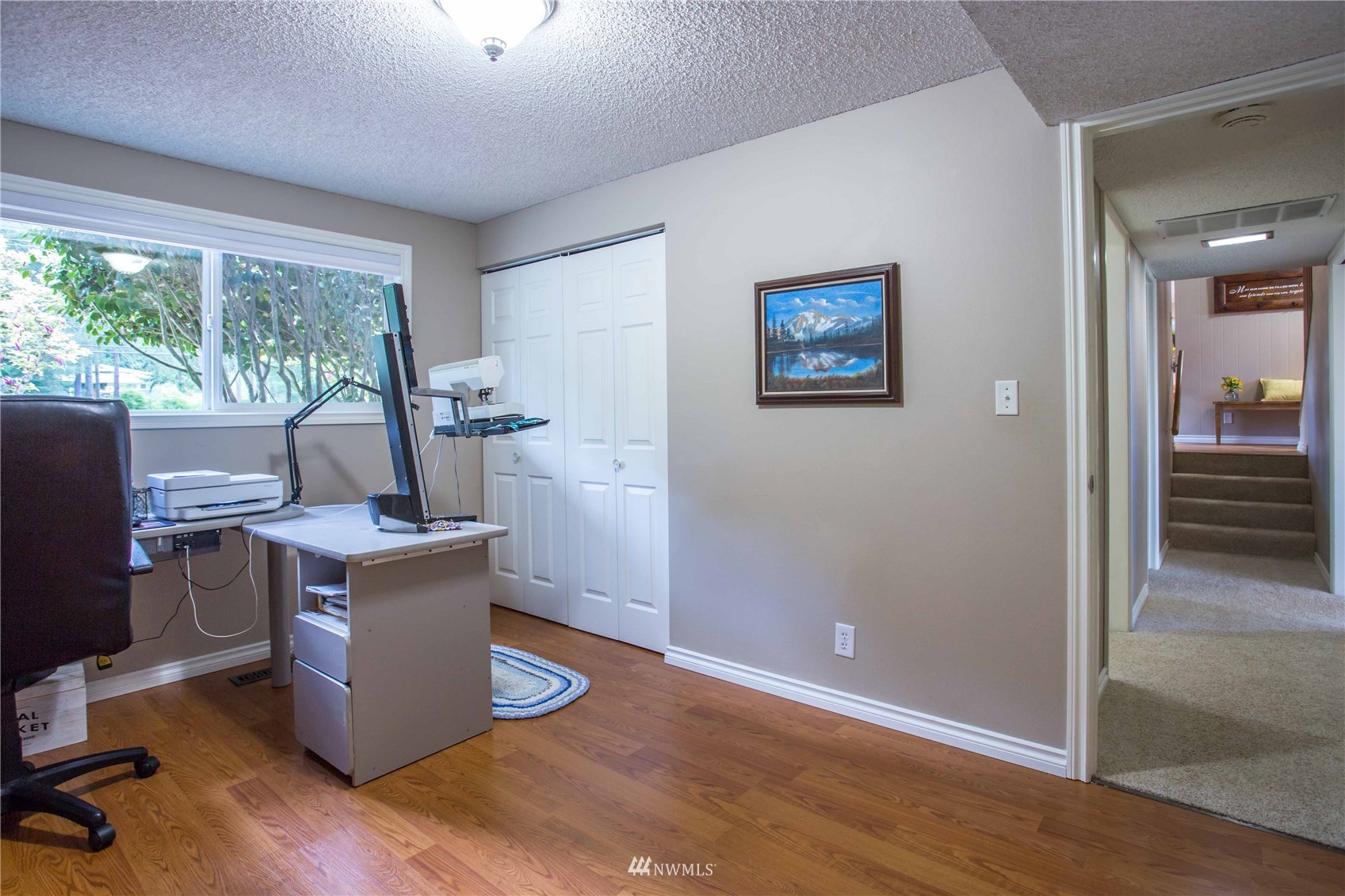 3951 Britton Road Bellingham, WA 98226 - Photo 23 of 39 a view of a workspace with furniture and a window