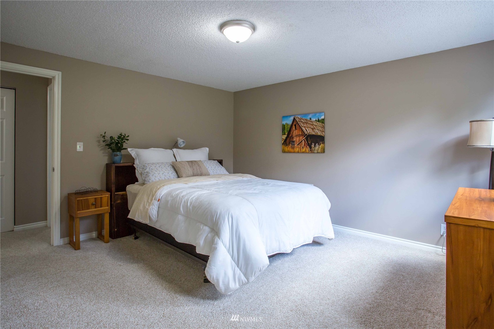 3951 Britton Road Bellingham, WA 98226 - Photo 29 of 39 a bedroom with a bed and a painting