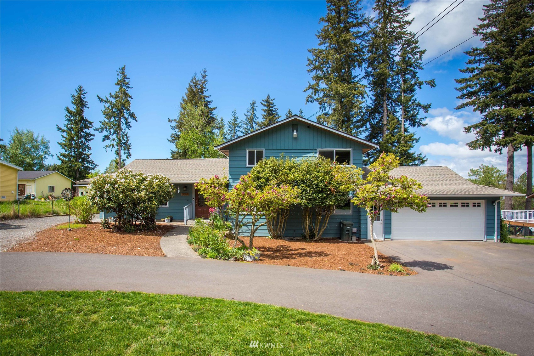 3951 Britton Road Bellingham, WA 98226 - Photo 3 of 39 a front view of a house with a yard and garage