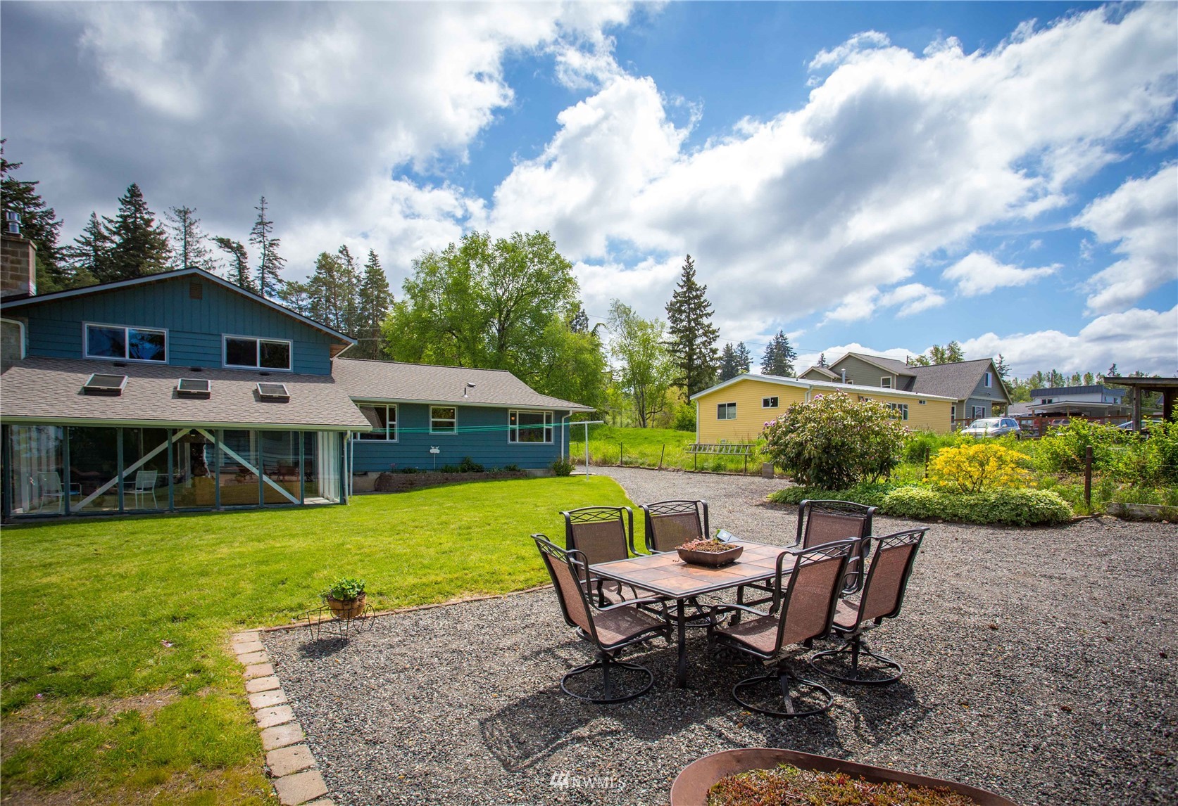 3951 Britton Road Bellingham, WA 98226 - Photo 34 of 39 a view of a house with backyard porch and sitting area