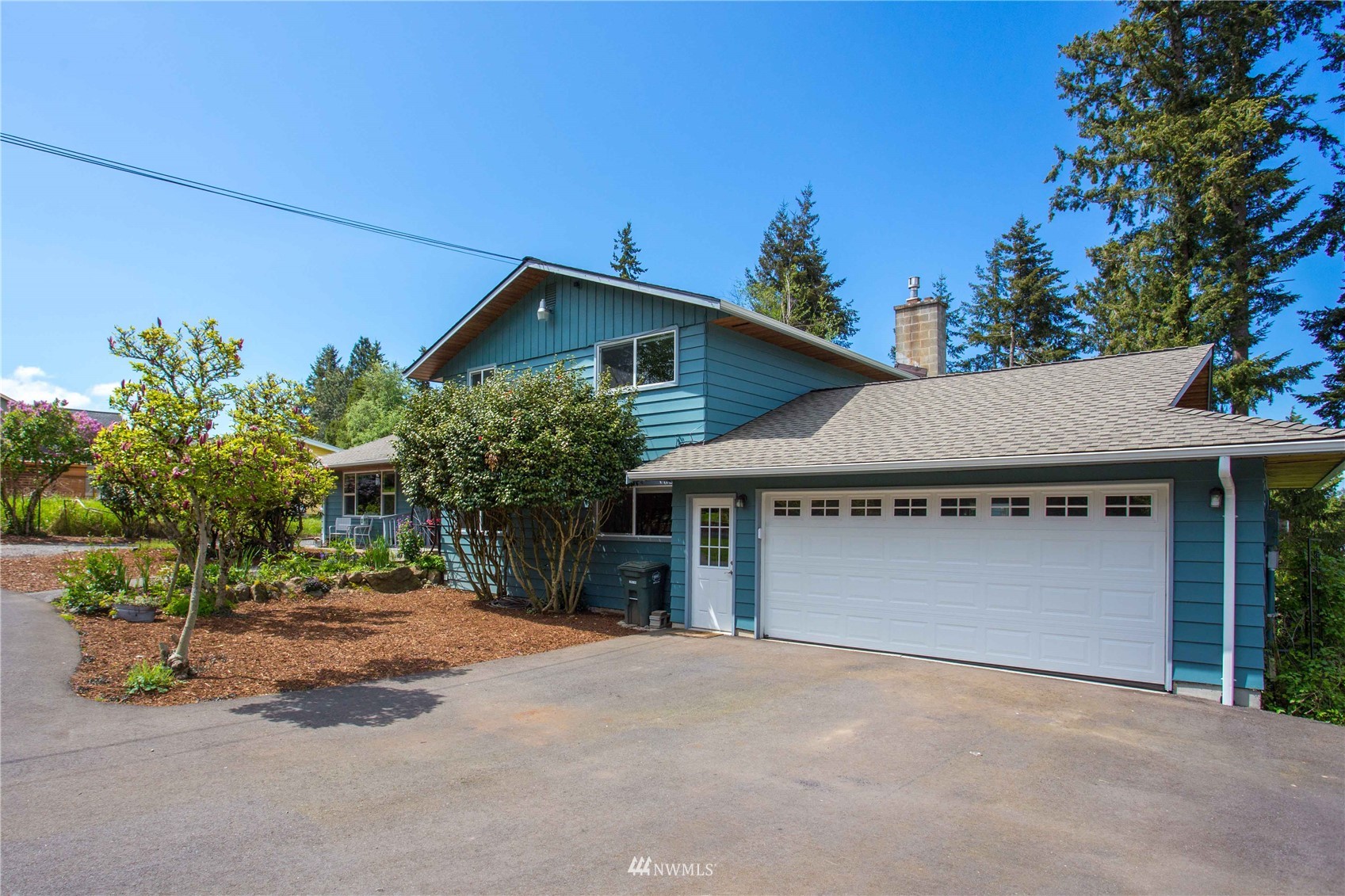 3951 Britton Road Bellingham, WA 98226 - Photo 6 of 39 a front view of a house with a yard and garage