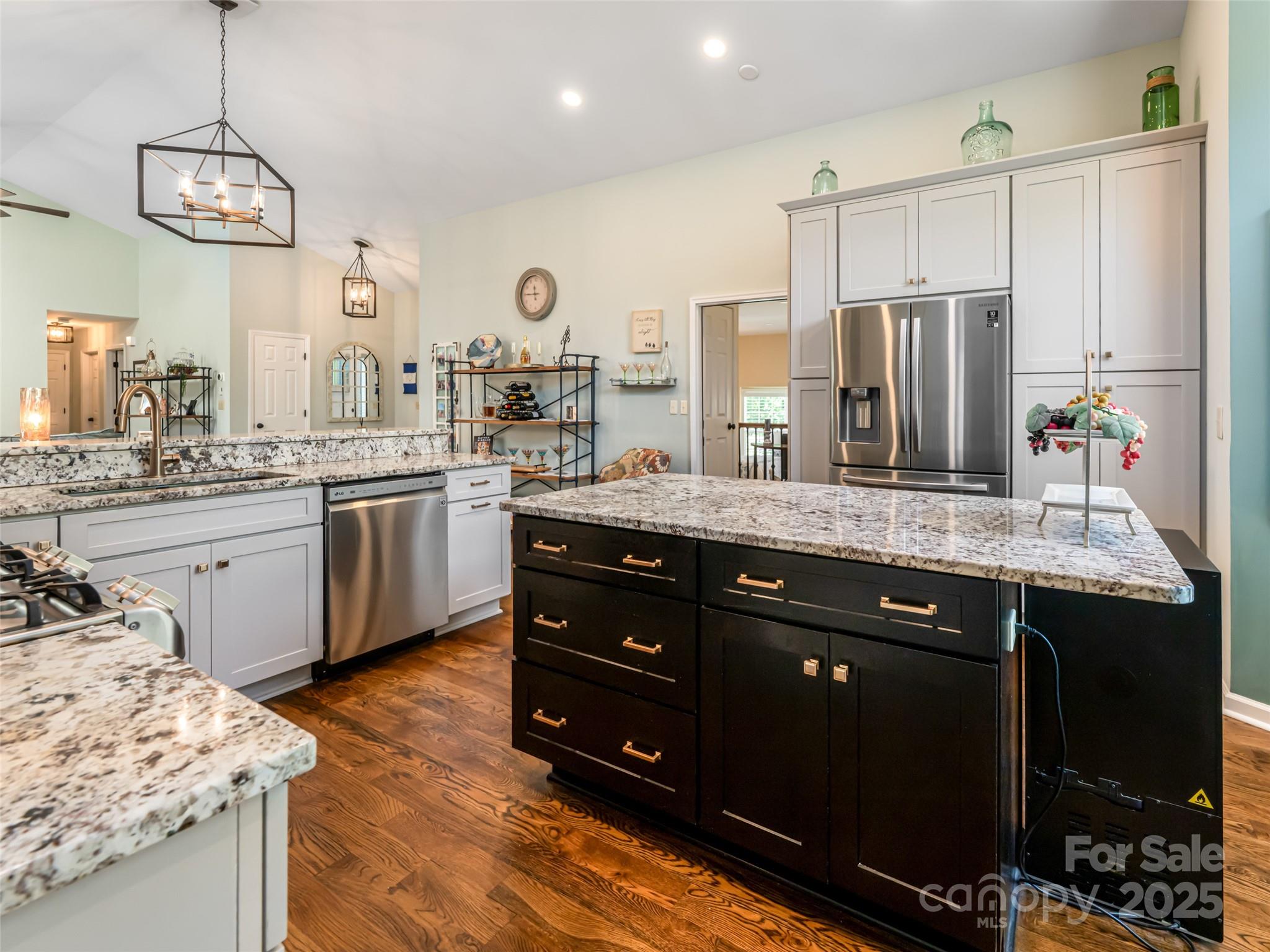 206 Pinner Road Arden, NC 28704 - Photo 17 of 47 a kitchen with stainless steel appliances granite countertop a sink a stove and a refrigerator