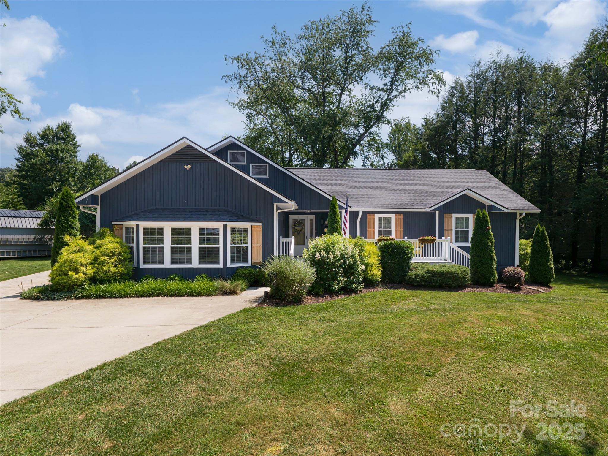206 Pinner Road Arden, NC 28704 - Photo 2 of 47 a front view of a house with a yard