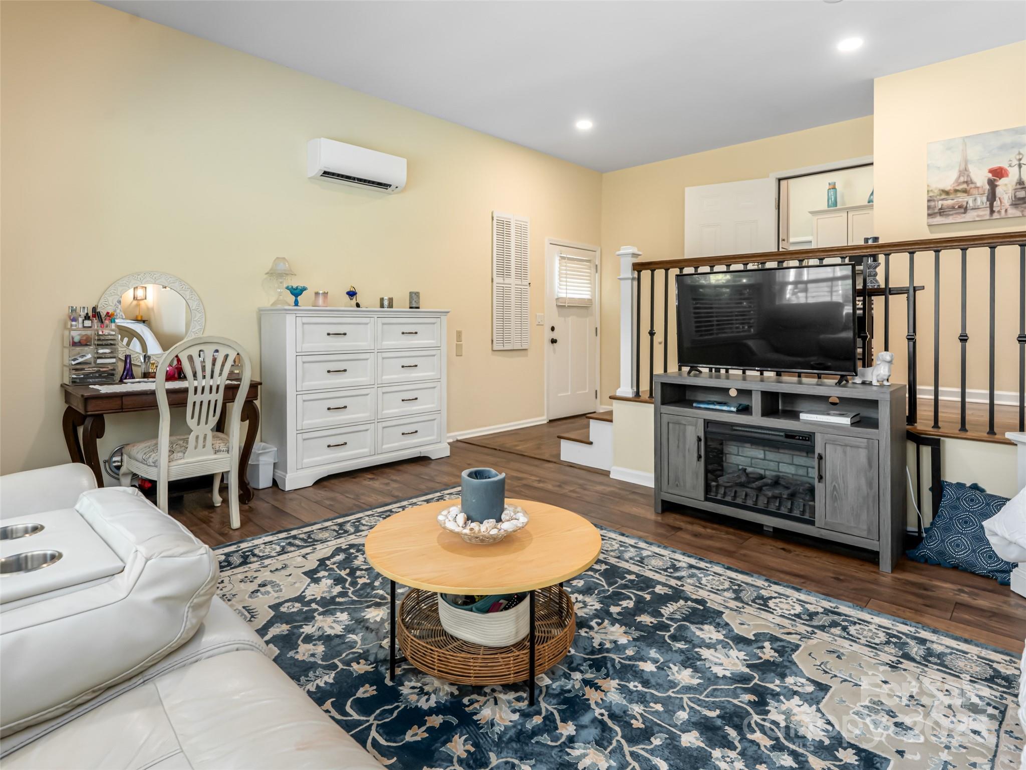 206 Pinner Road Arden, NC 28704 - Photo 23 of 47 a living room with furniture and a flat screen tv