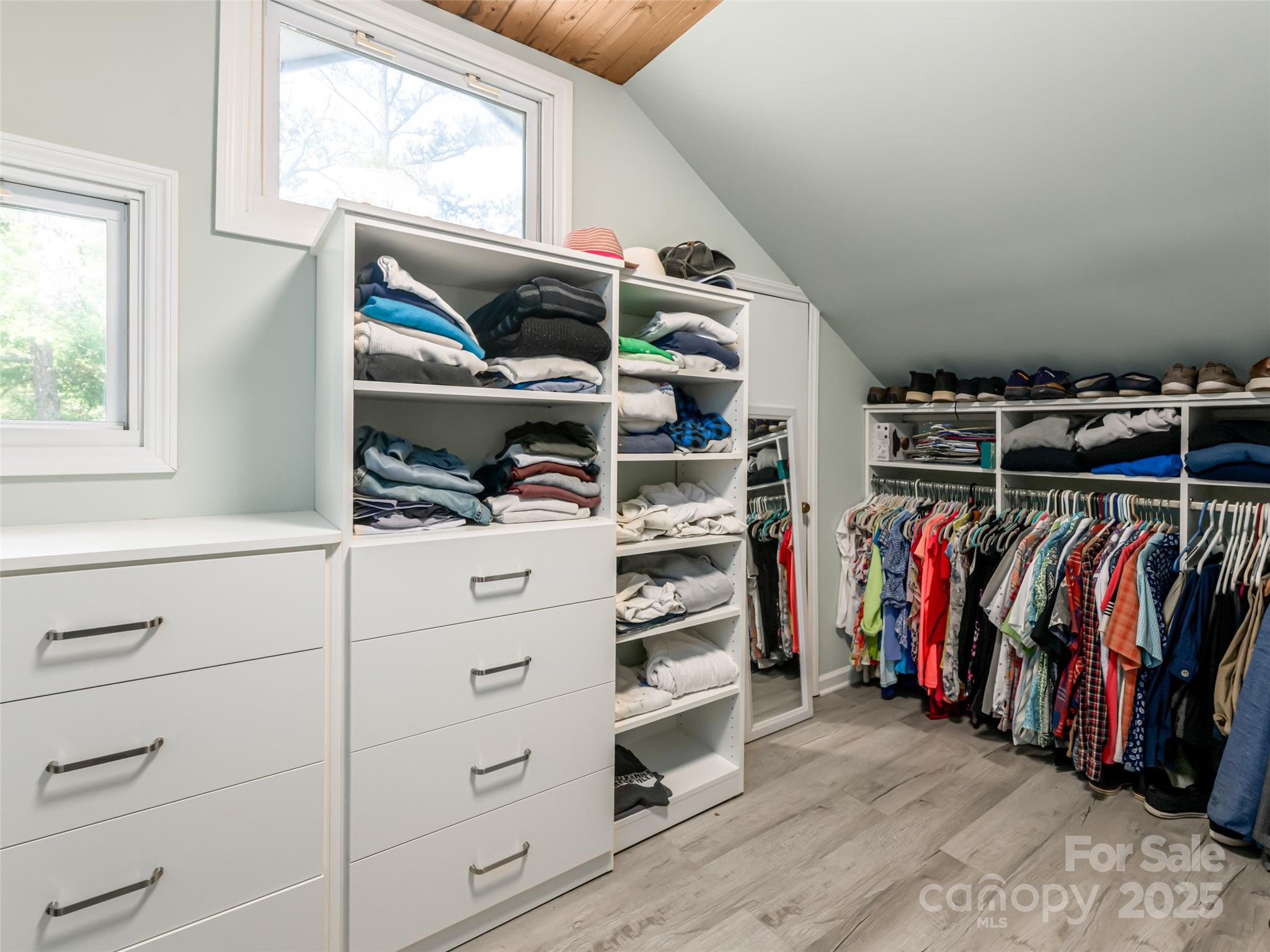 206 Pinner Road Arden, NC 28704 - Photo 26 of 47 a view of walk in closet with clothes and shoes
