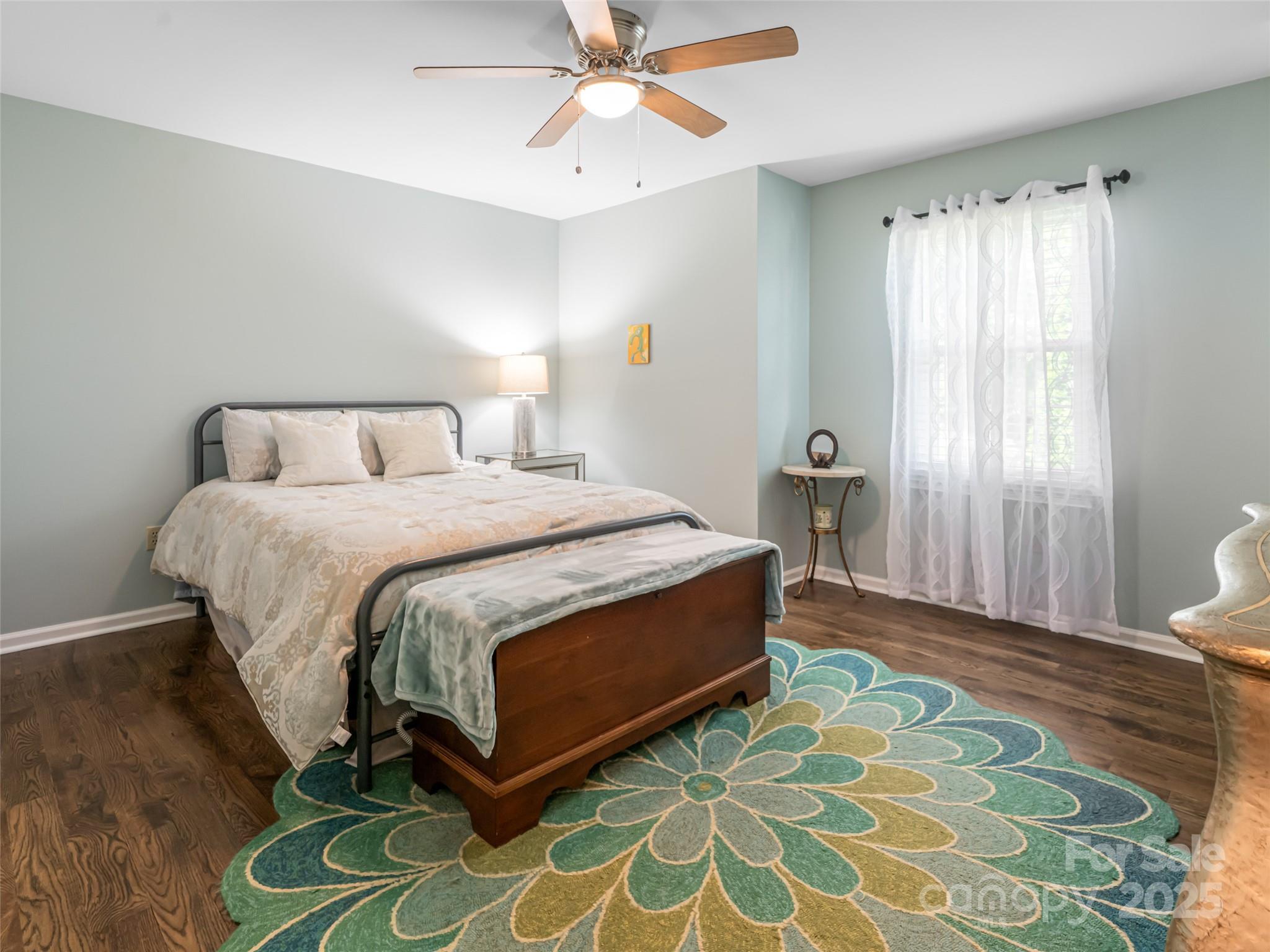 206 Pinner Road Arden, NC 28704 - Photo 32 of 47 a bed room with a bed and a chandelier