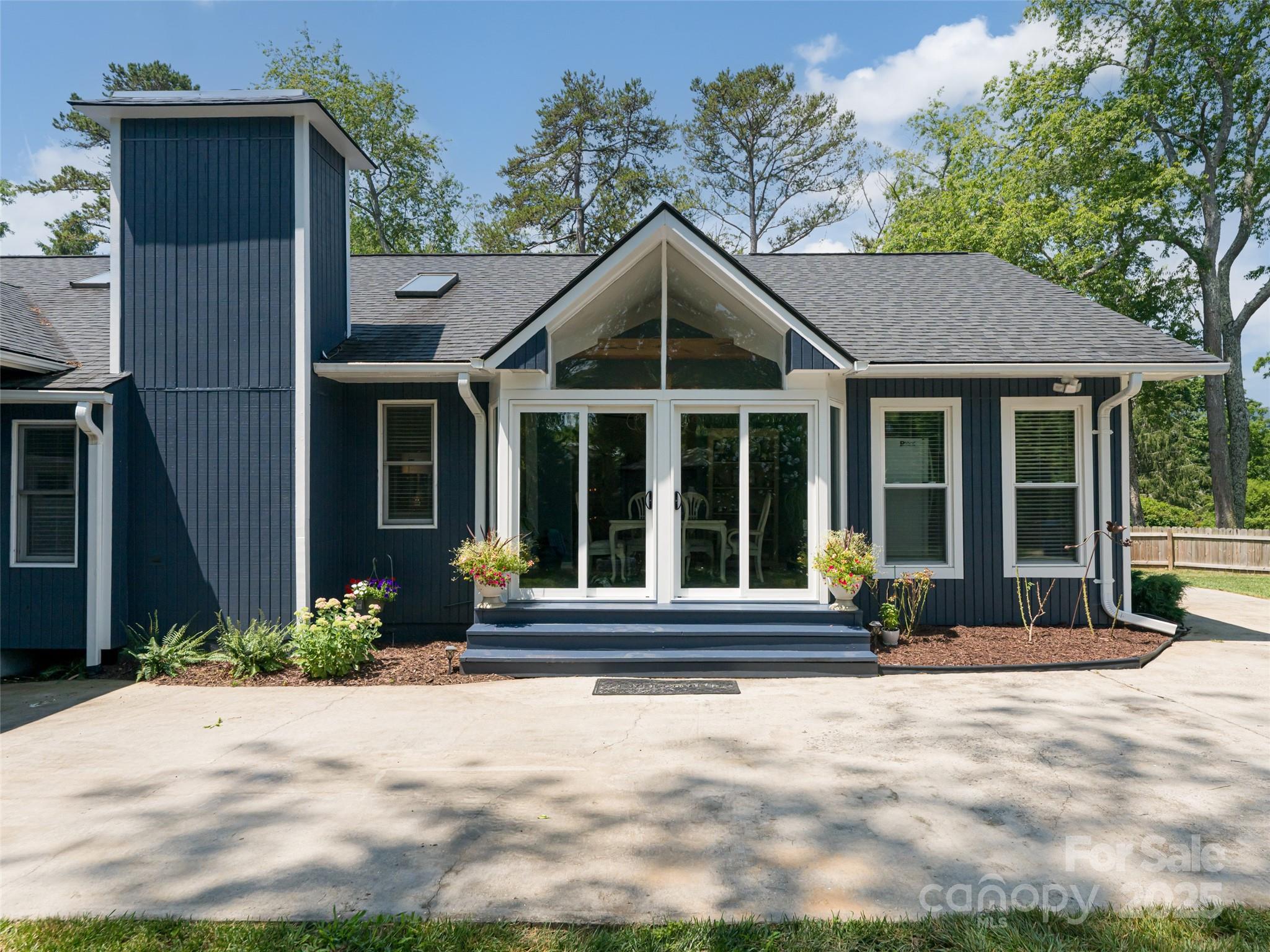 206 Pinner Road Arden, NC 28704 - Photo 34 of 47 a front view of a house with a yard and glass windows