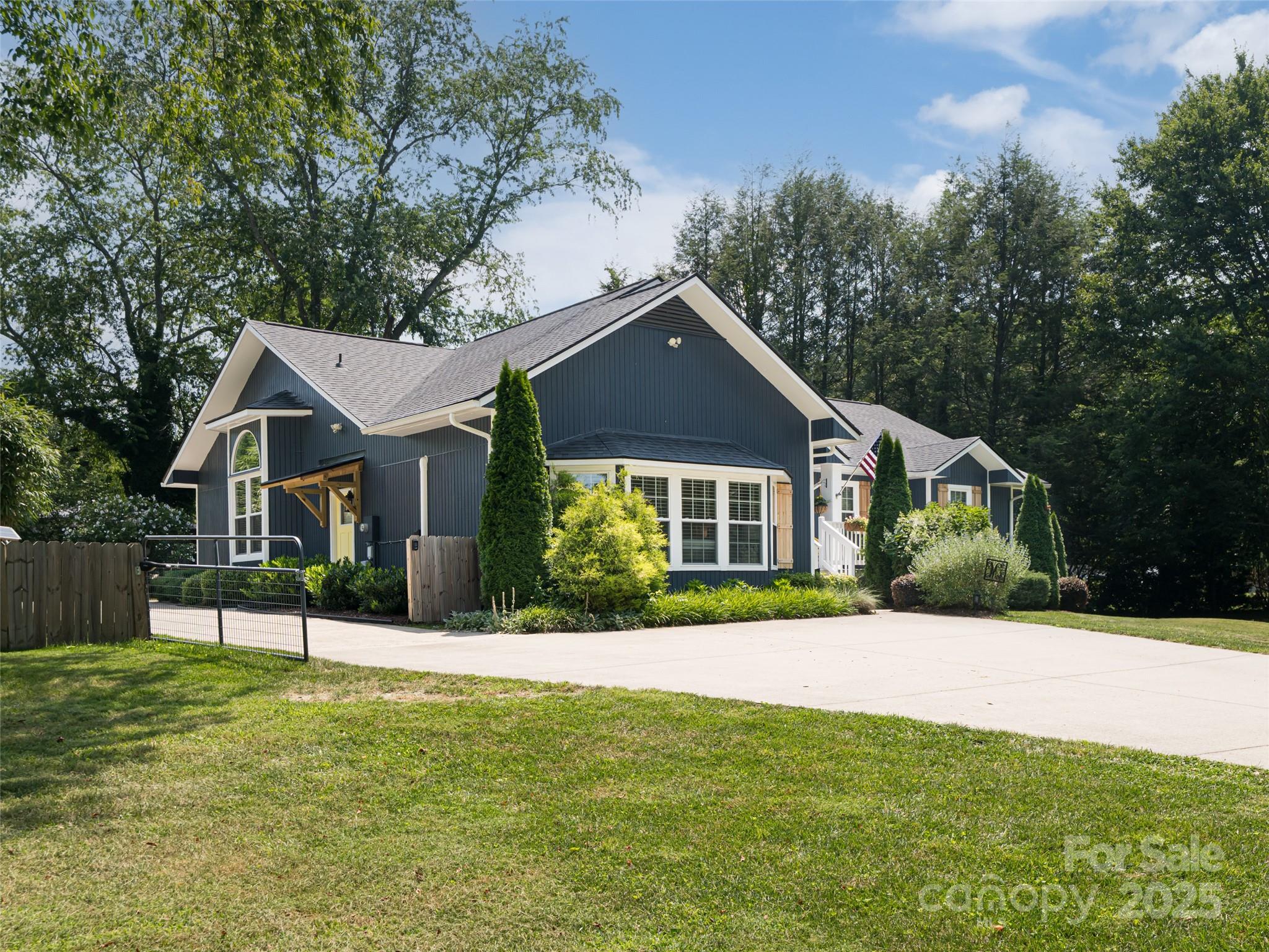206 Pinner Road Arden, NC 28704 - Photo 4 of 47 a front view of a house with a yard