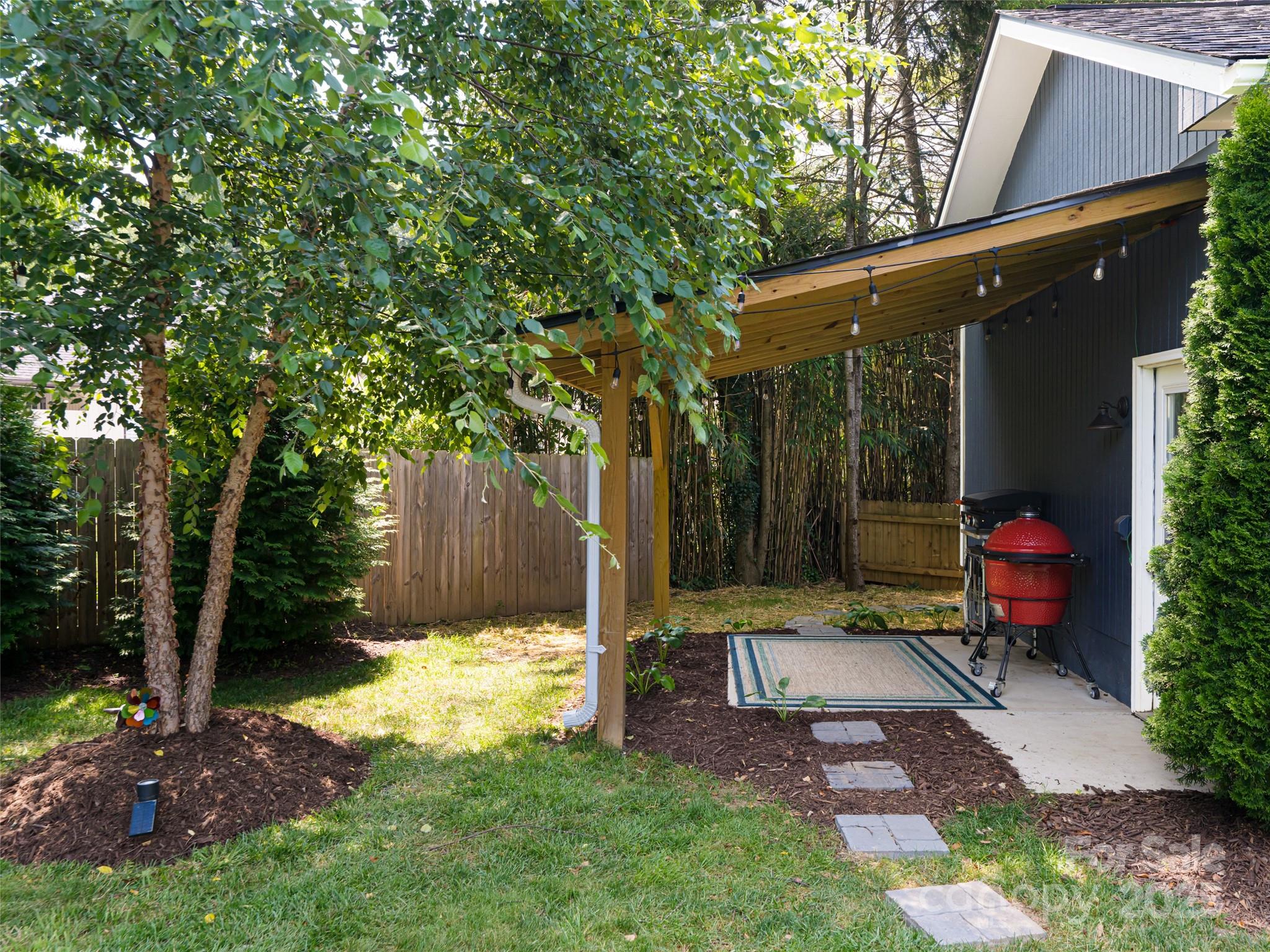 206 Pinner Road Arden, NC 28704 - Photo 41 of 47 a view of a chair and table in backyard