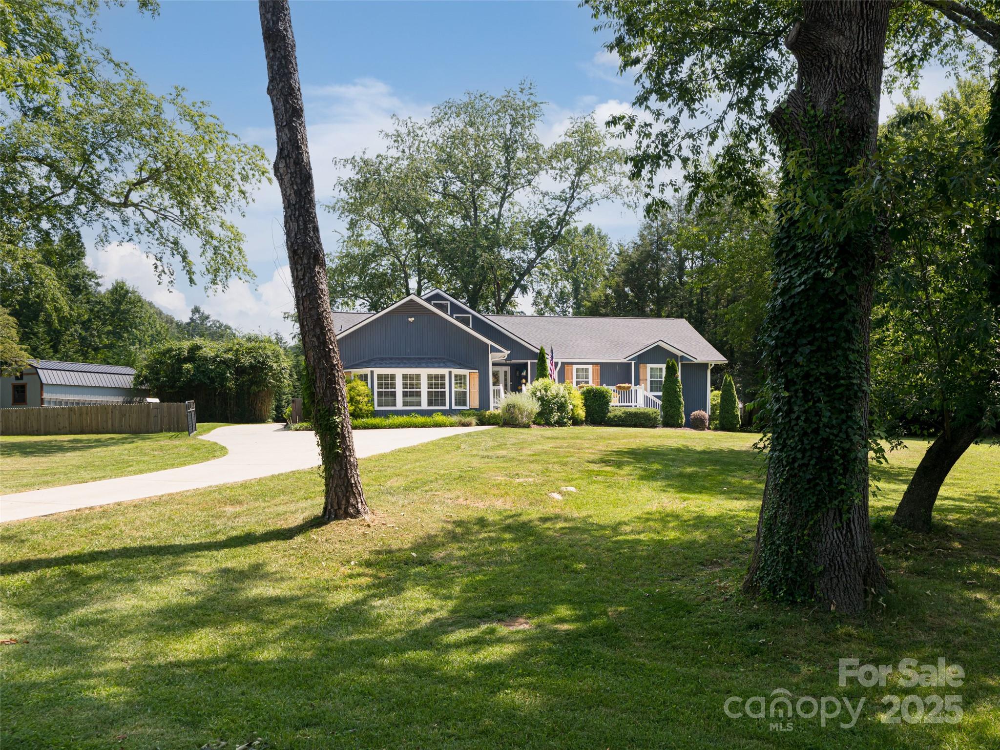 206 Pinner Road Arden, NC 28704 - Photo 43 of 47 a front view of house with yard and green space