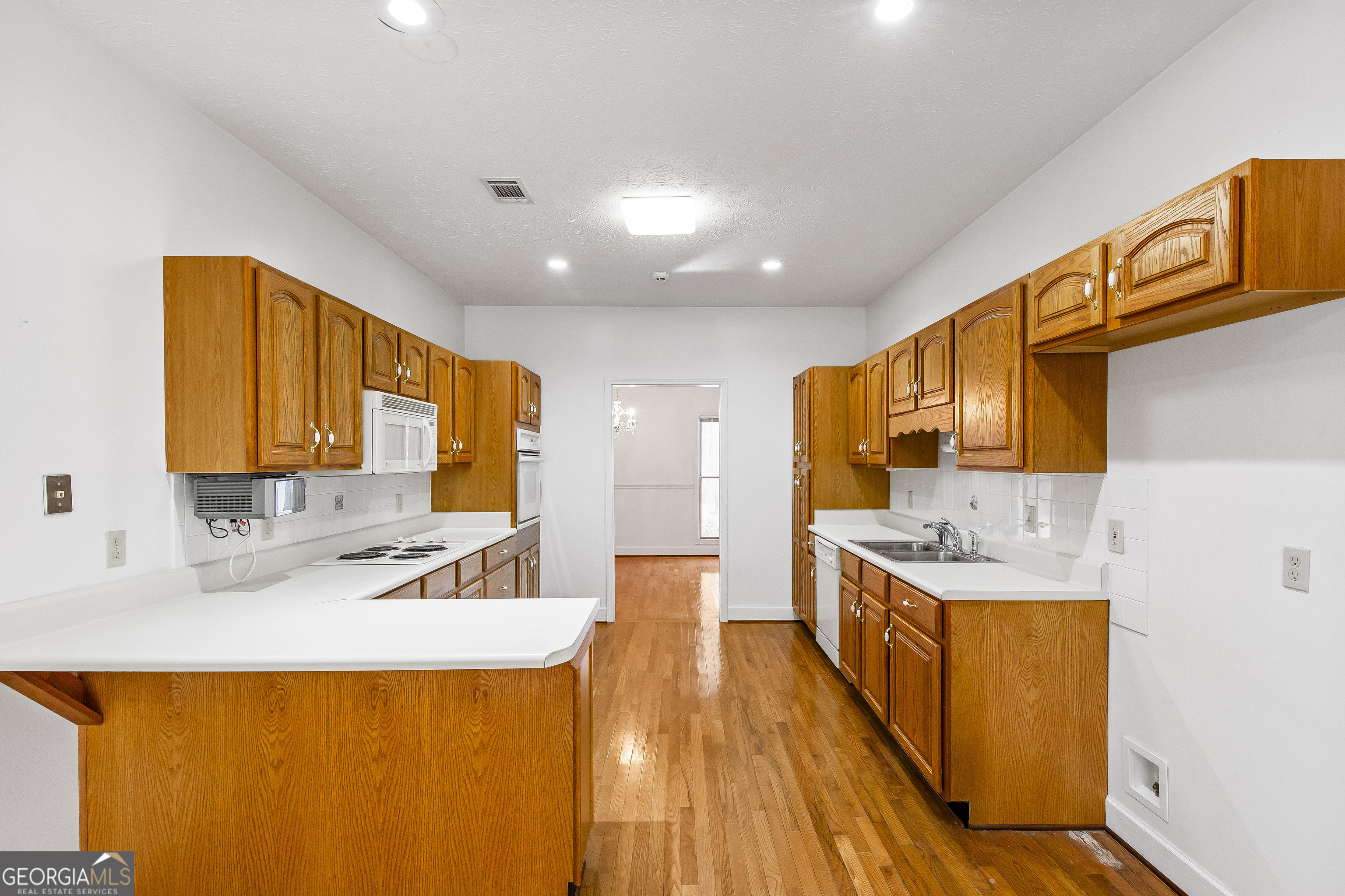 273 High Point Road Buchanan, GA 30113 - Photo 17 of 73 a kitchen with a sink a counter top space and stainless steel appliances