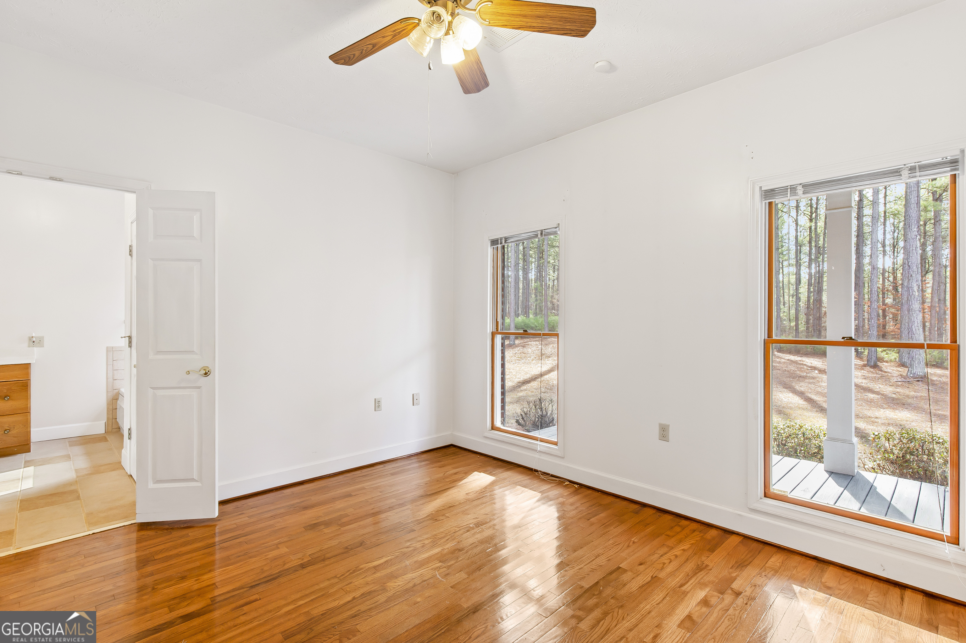 273 High Point Road Buchanan, GA 30113 - Photo 23 of 73 an empty room with wooden floor and windows