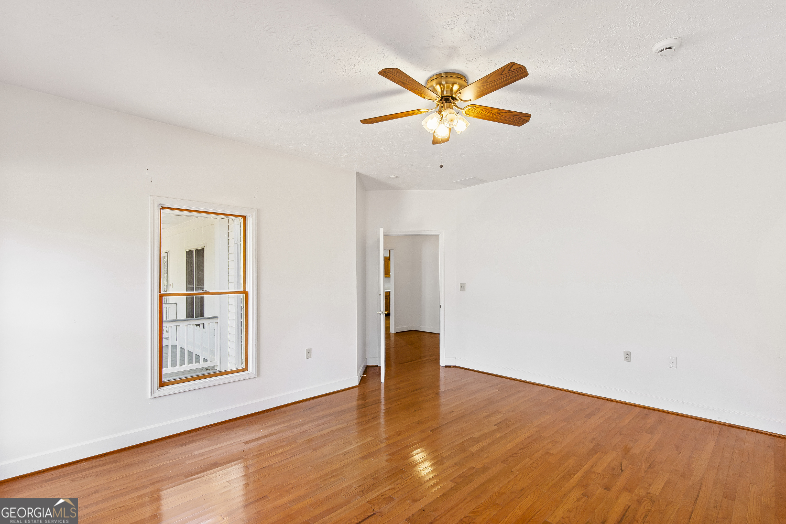 273 High Point Road Buchanan, GA 30113 - Photo 28 of 73 a view of an empty room with window and wooden floor