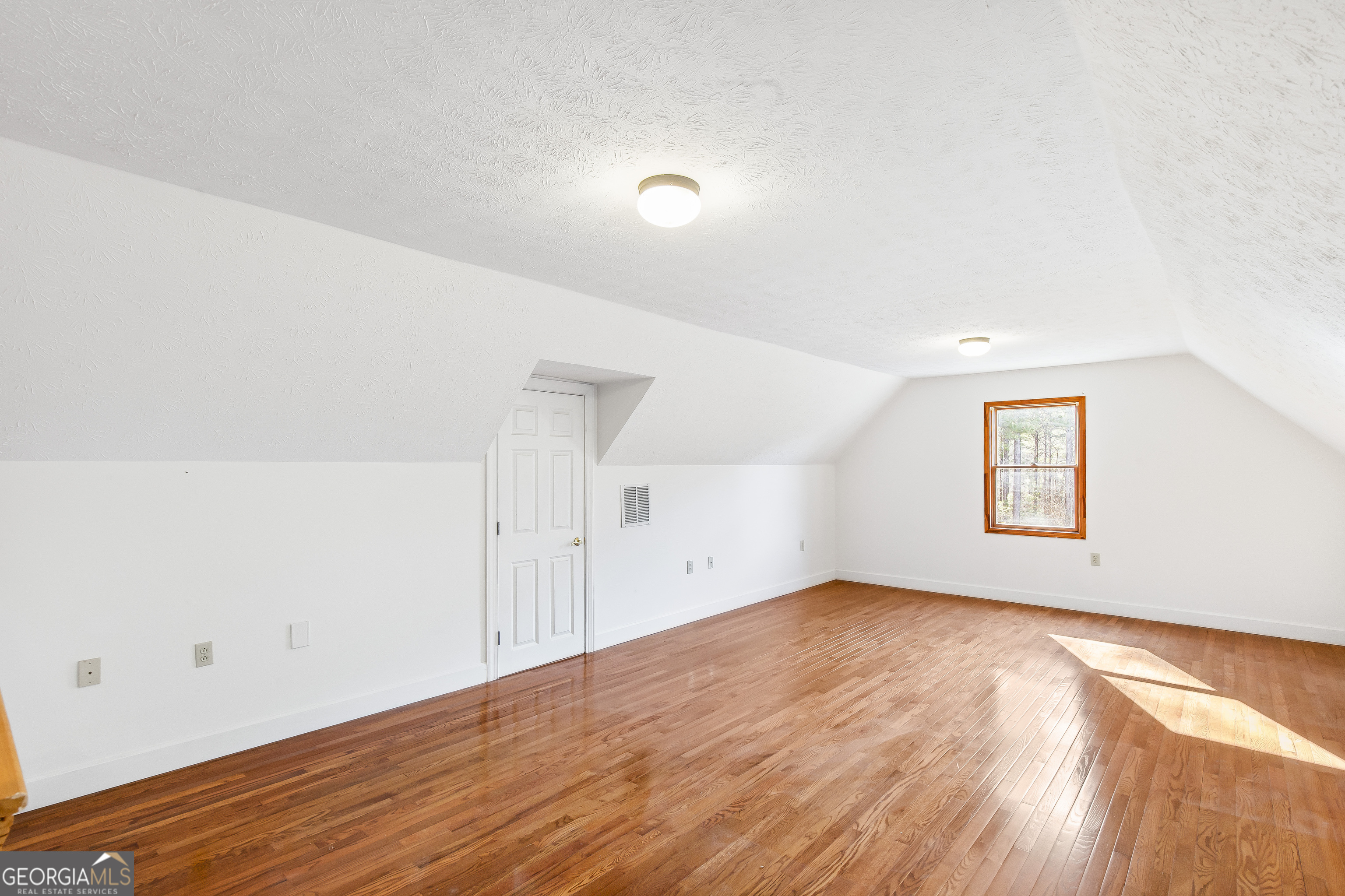 273 High Point Road Buchanan, GA 30113 - Photo 29 of 73 an empty room with wooden floor and windows
