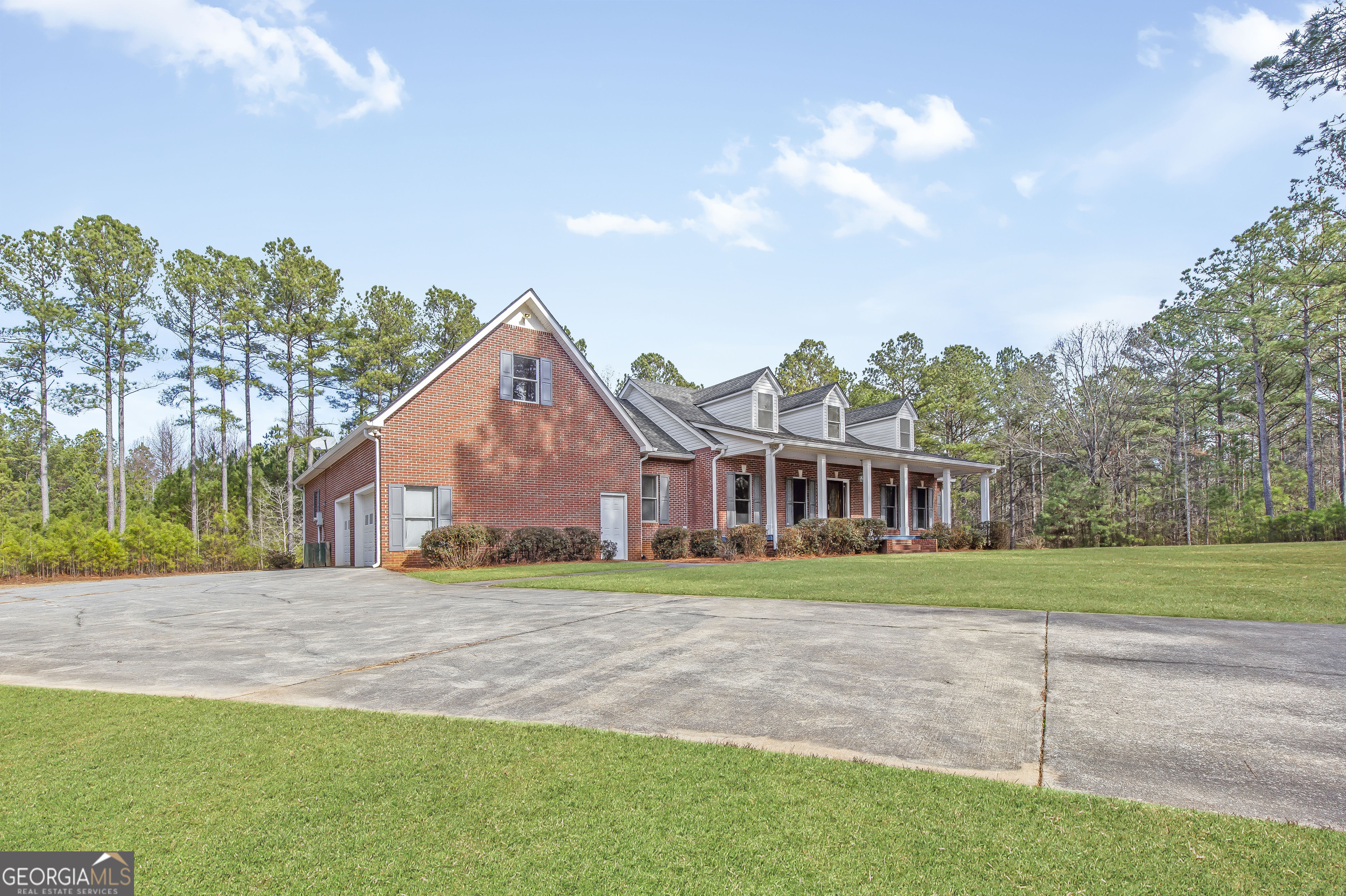 273 High Point Road Buchanan, GA 30113 - Photo 4 of 73 a front view of a house with a yard and trees