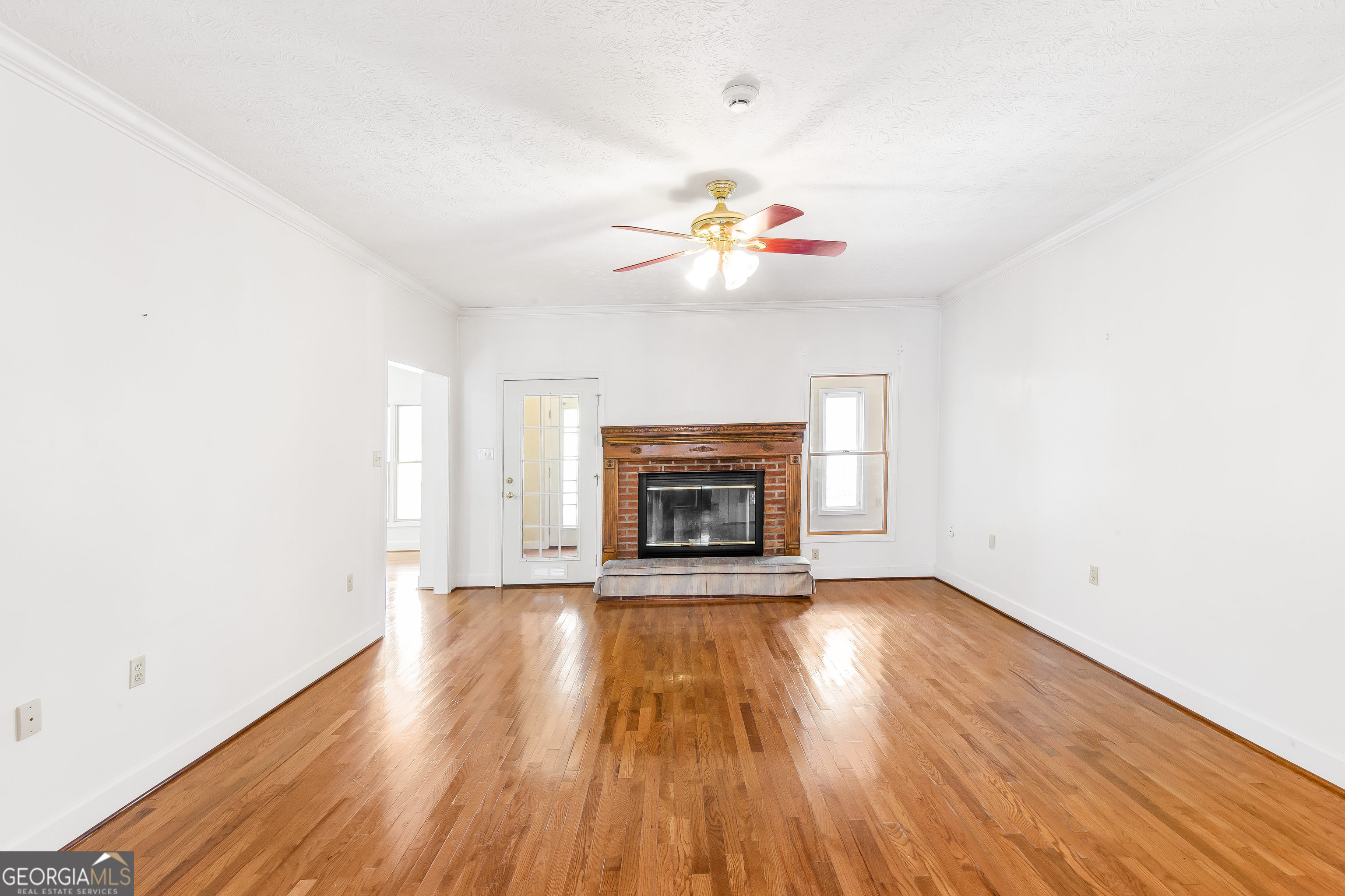 273 High Point Road Buchanan, GA 30113 - Photo 44 of 73 a view of an empty room with a fireplace and a chandelier