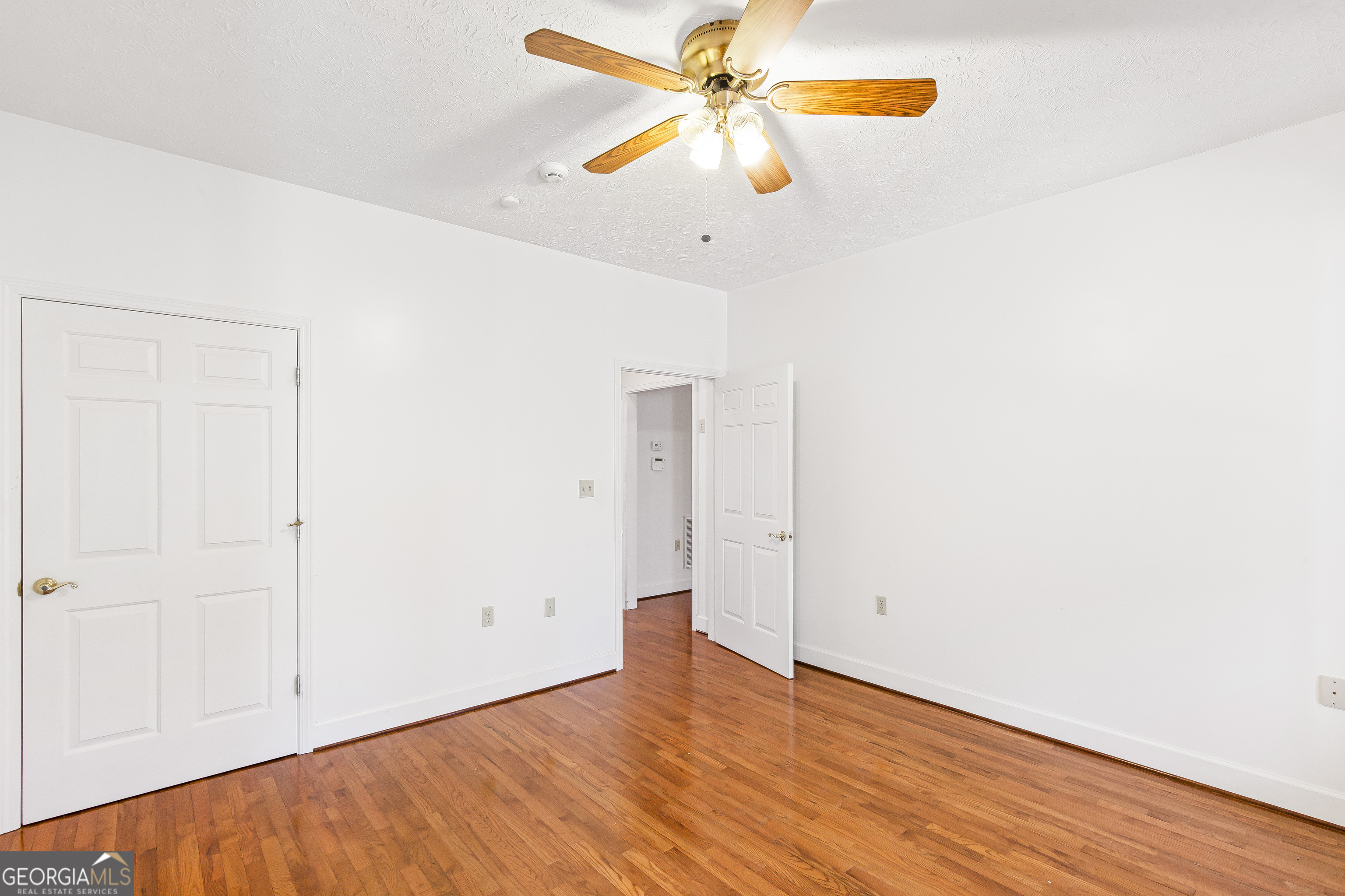273 High Point Road Buchanan, GA 30113 - Photo 45 of 73 an empty room with wooden floor fan and windows