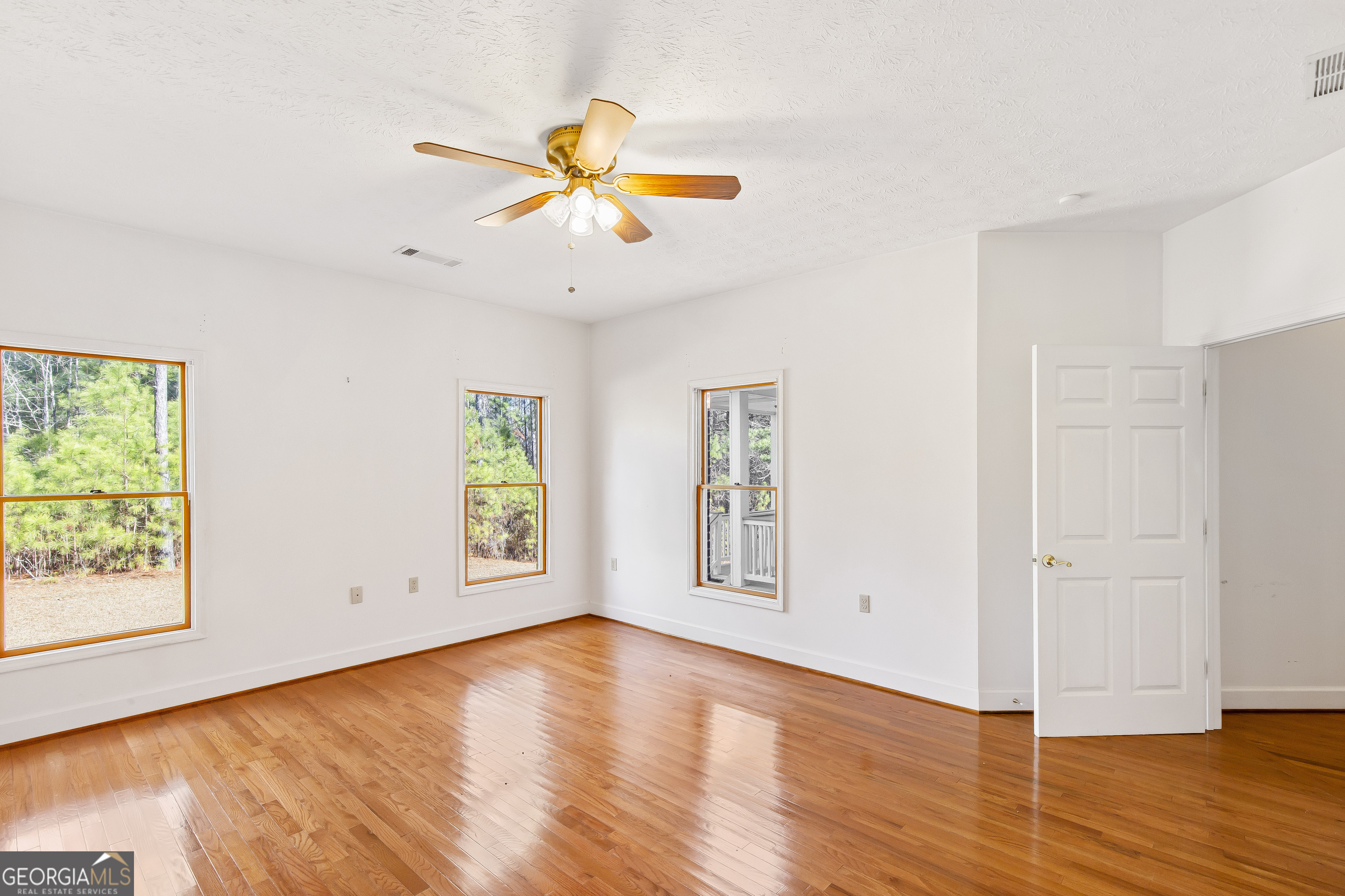 273 High Point Road Buchanan, GA 30113 - Photo 47 of 73 a view of an empty room with window and wooden floor