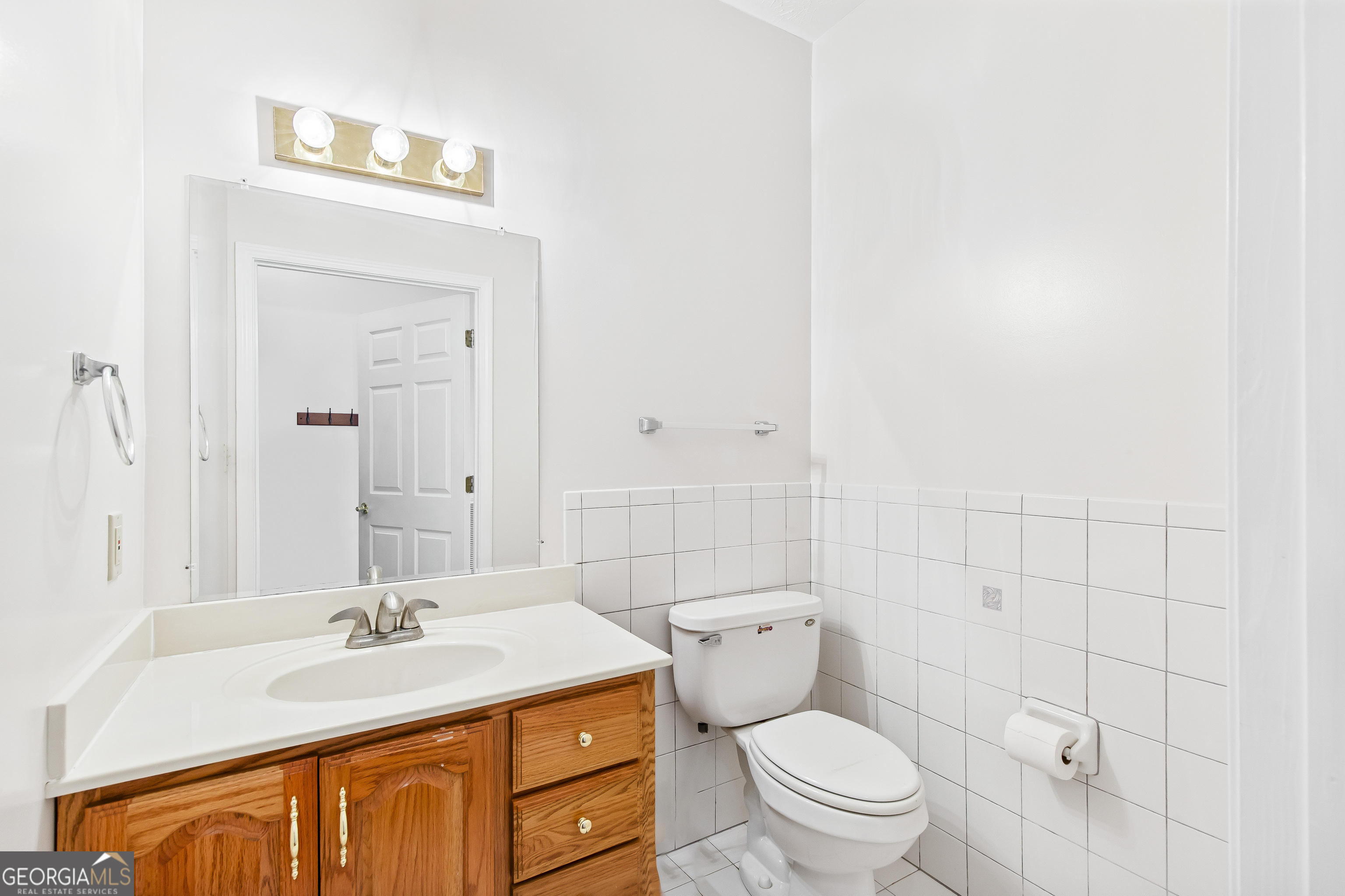 273 High Point Road Buchanan, GA 30113 - Photo 49 of 73 a bathroom with a granite countertop sink a toilet and a mirror