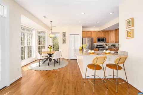 a living room with furniture fireplace and window