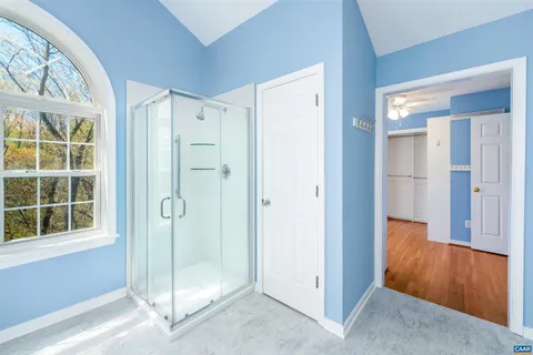 a view of a kitchen with white cabinets