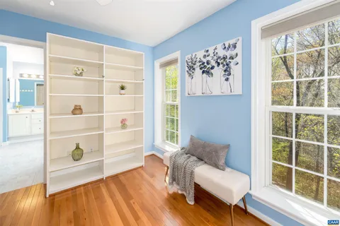 a backyard of a house with lots of green space and seating