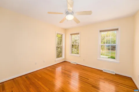 a view of a house with backyard porch and sitting area