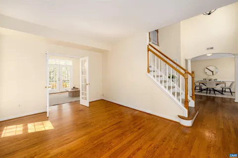 a view of an entryway with wooden floor