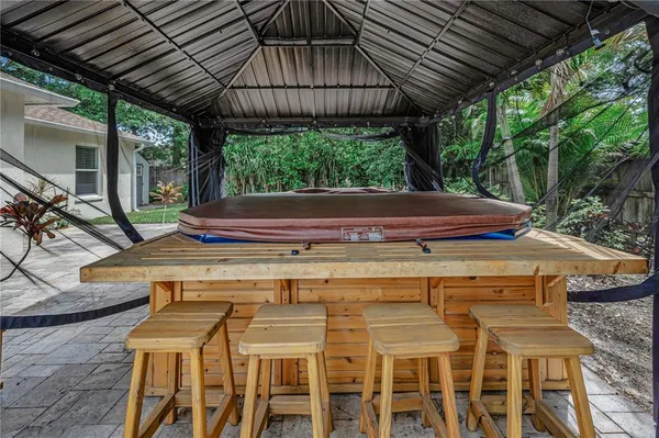 wooden floor in an empty room with a kitchen