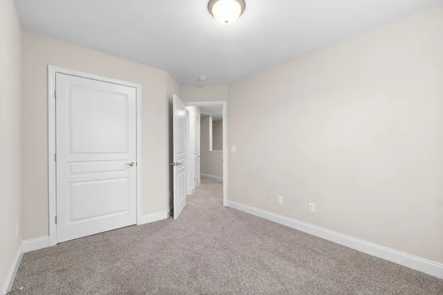 an empty room with closet area