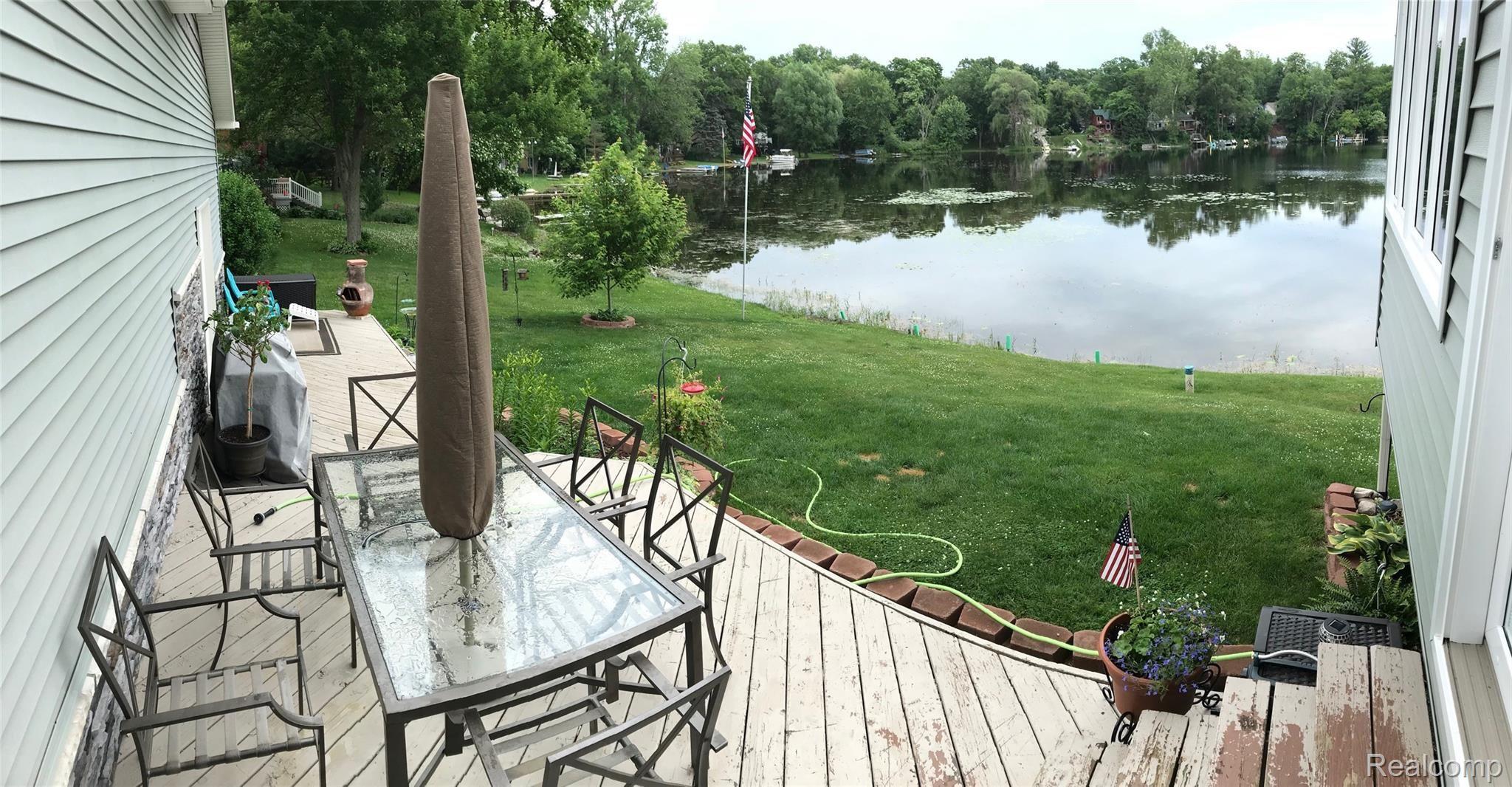 1480 Clark Lake Road Brighton, MI 48114 - Photo 14 of 36 Spacious deck overlooking the lake.