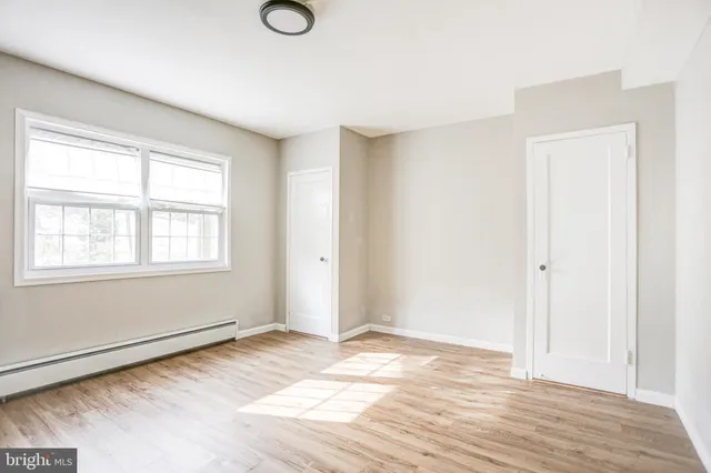 a view of a livingroom with wooden floor