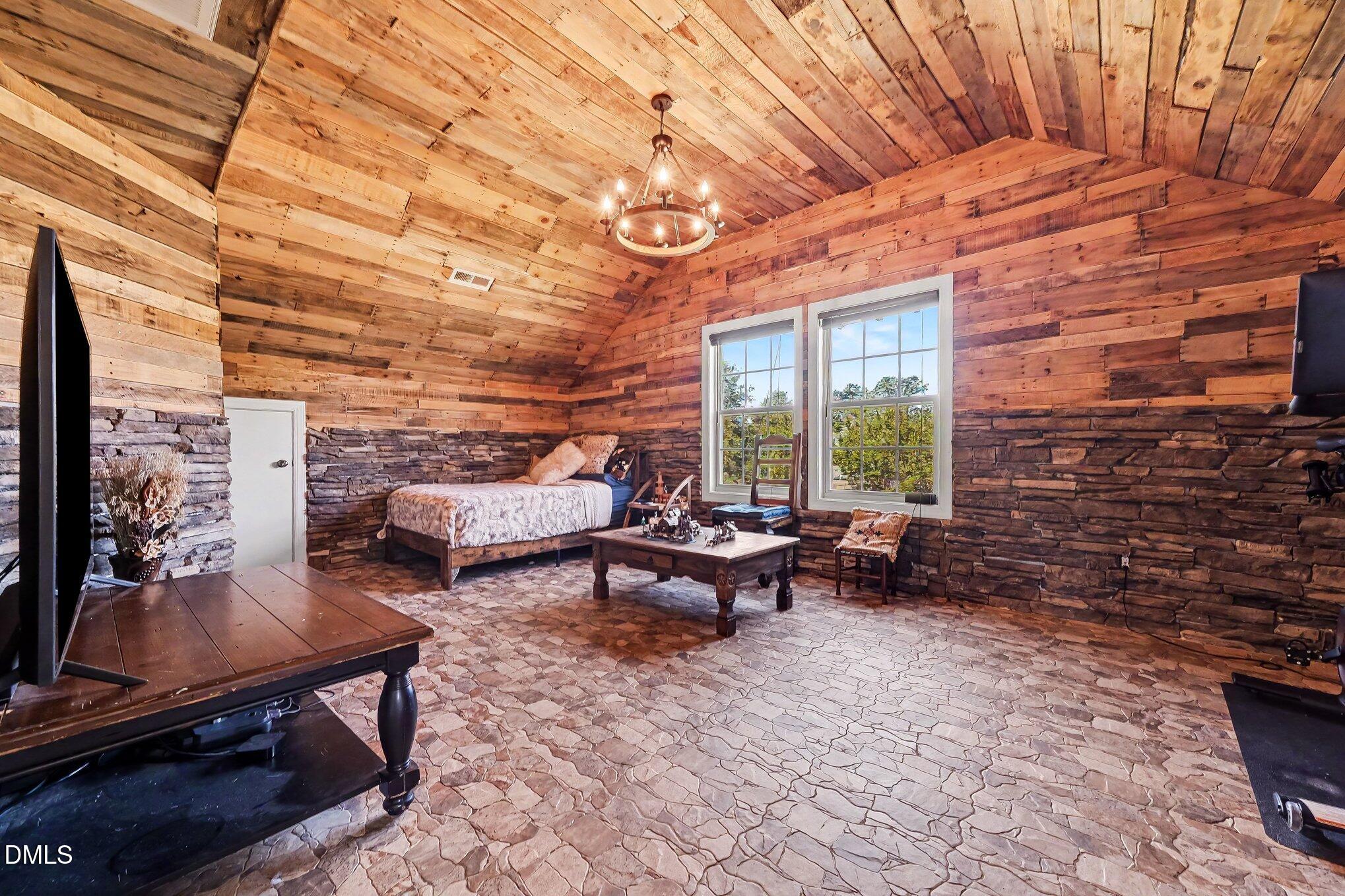 4000 Banks Stone Drive Raleigh, NC 27603 - Photo 35 of 60 a living room with patio furniture and a fireplace