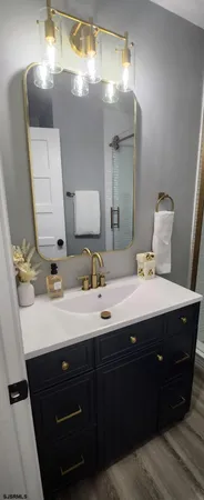a bathroom with a double vanity sink and mirror